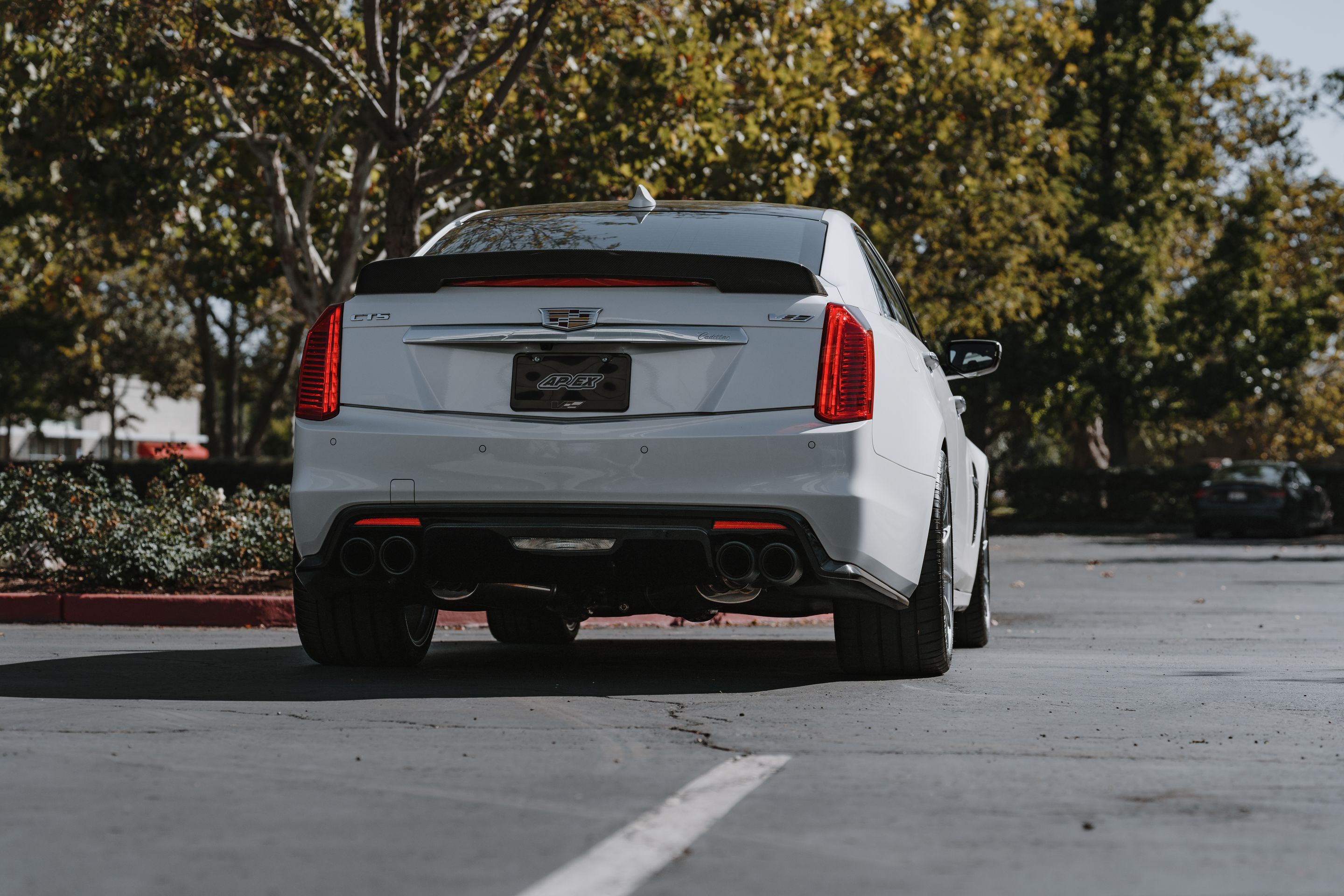 White Cadillac Gen 3 CTS-V with 19" SM-10RS Apex wheels in Brushed Clear