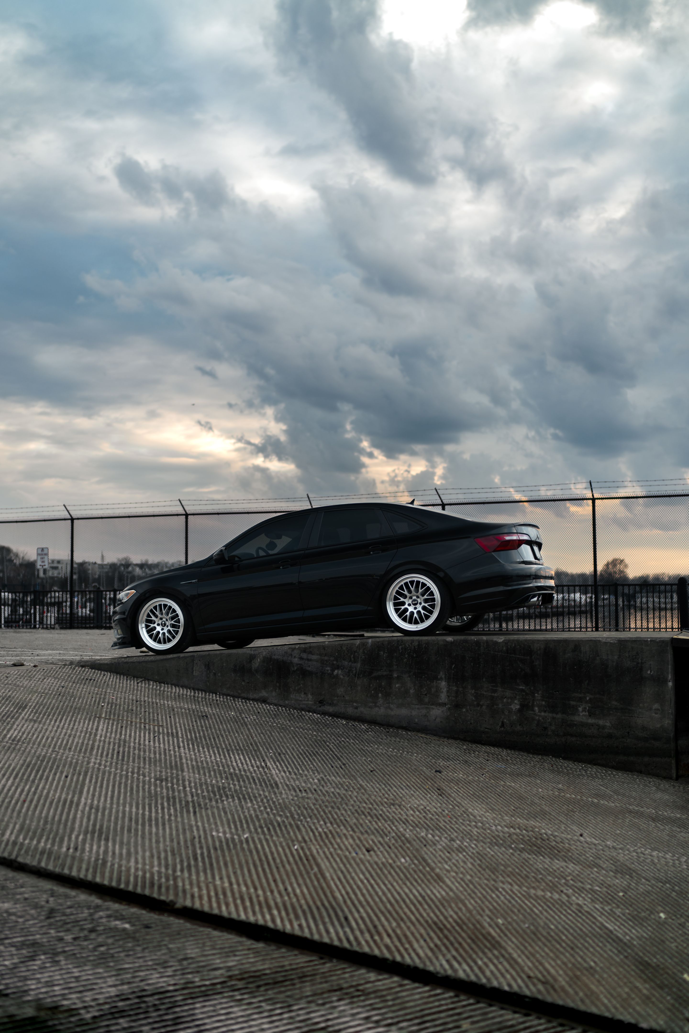 Black VW MK7 Jetta with 19" ML-10RT Apex wheels in Machined Lip Race Silver