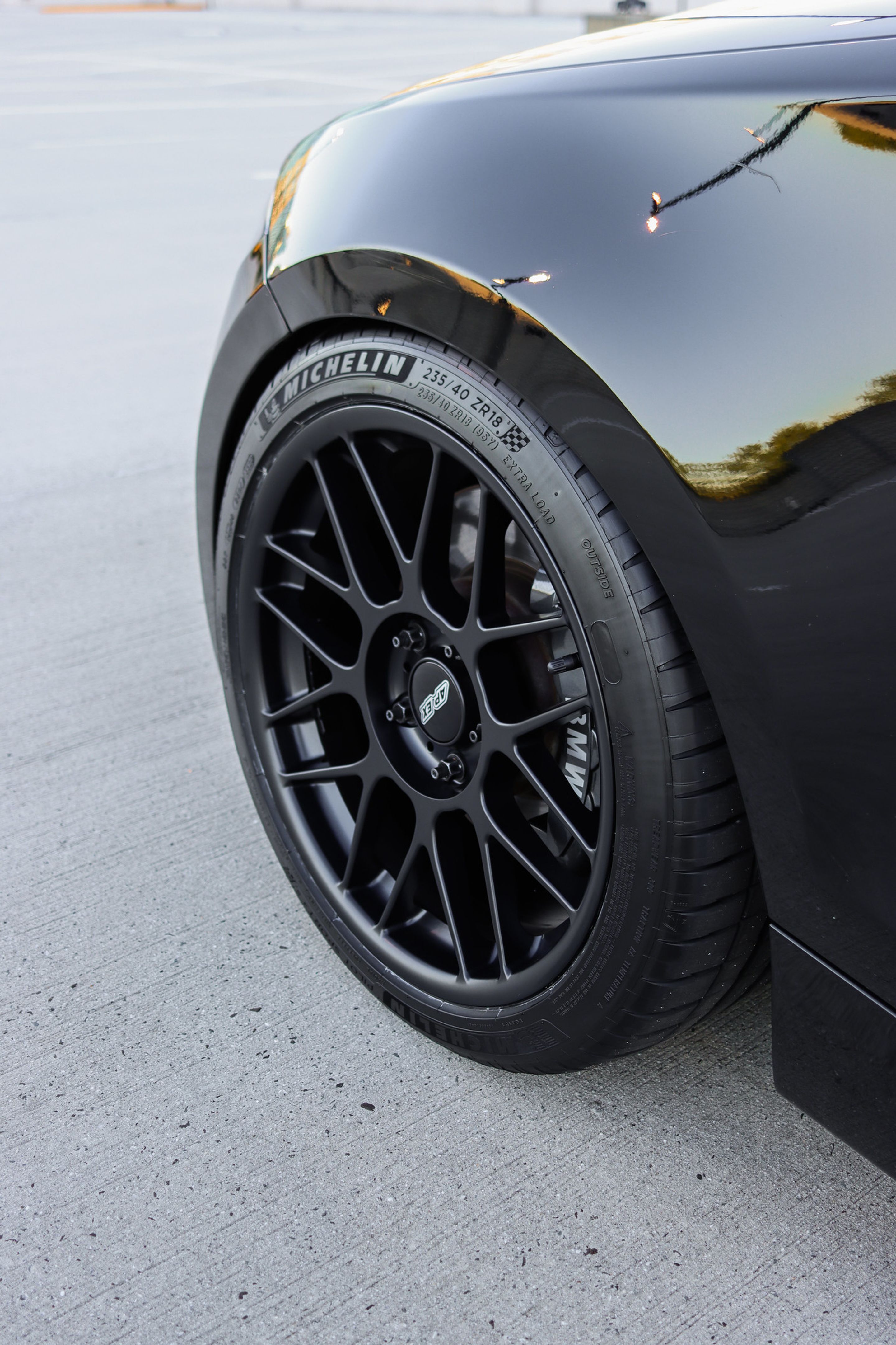 Black BMW E82 Coupe 1 Series with 18" ARC-8 Apex wheels in Satin Black