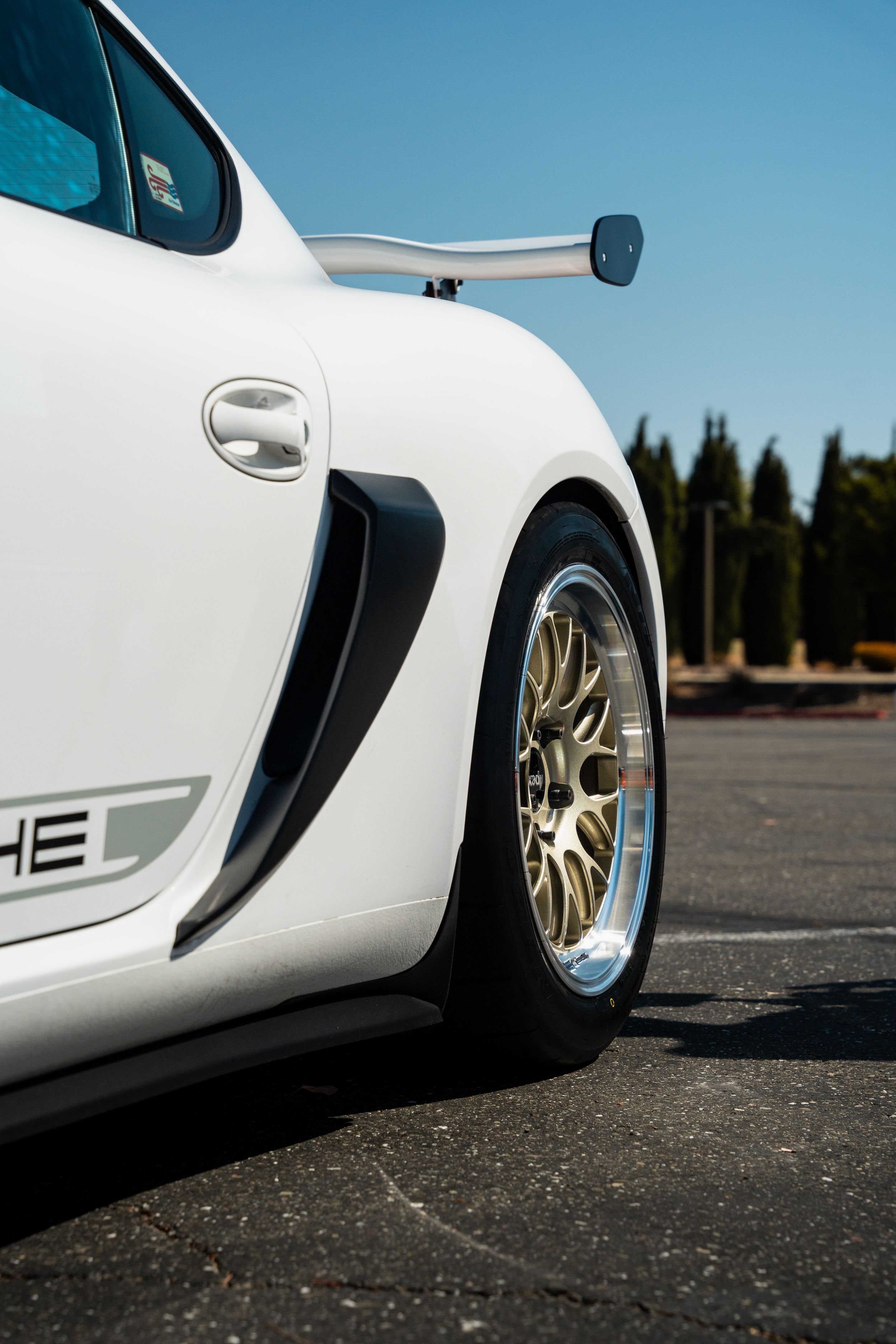 White Porsche 987 Cayman Base with 18" ML-10RT Apex wheels in Machined Lip Gloss Motorsport Gold