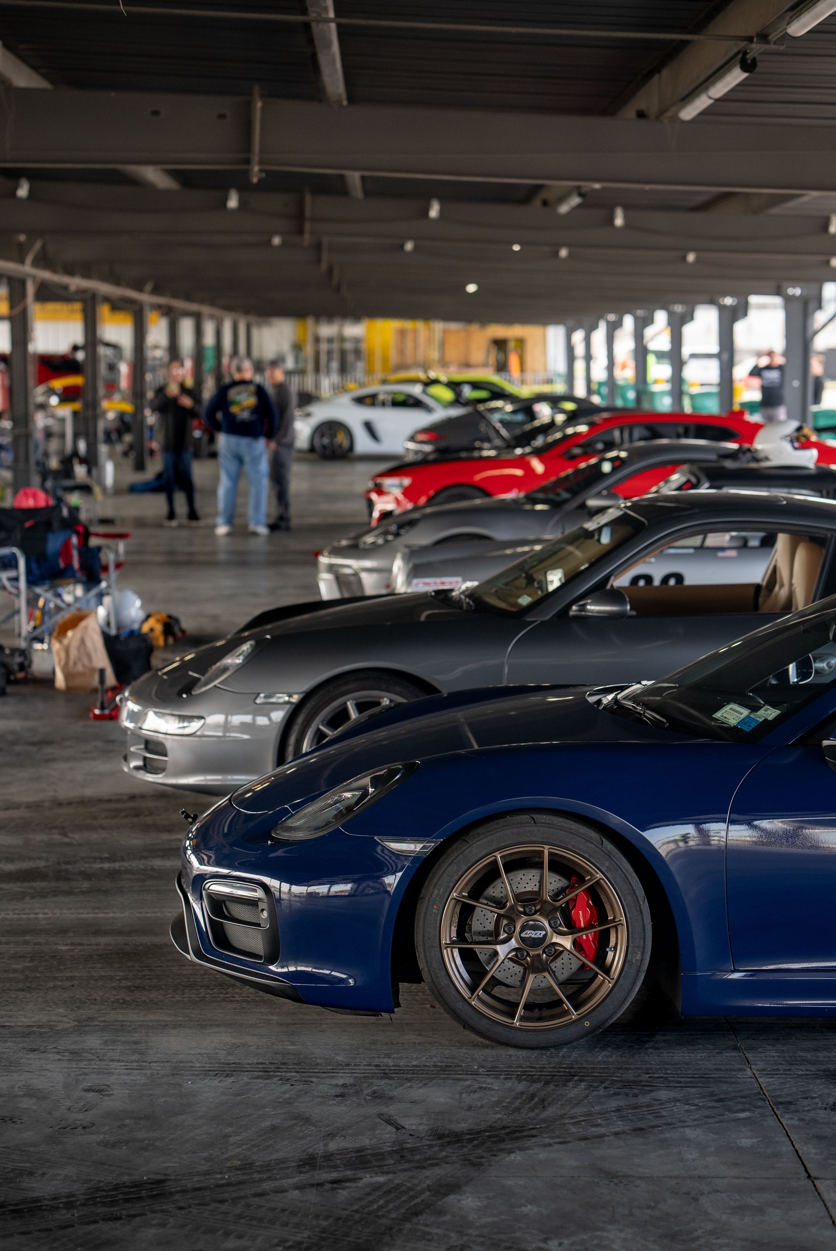 Blue Porsche 981 Cayman GTS with 18" VS-5RS Apex wheels in Satin Bronze