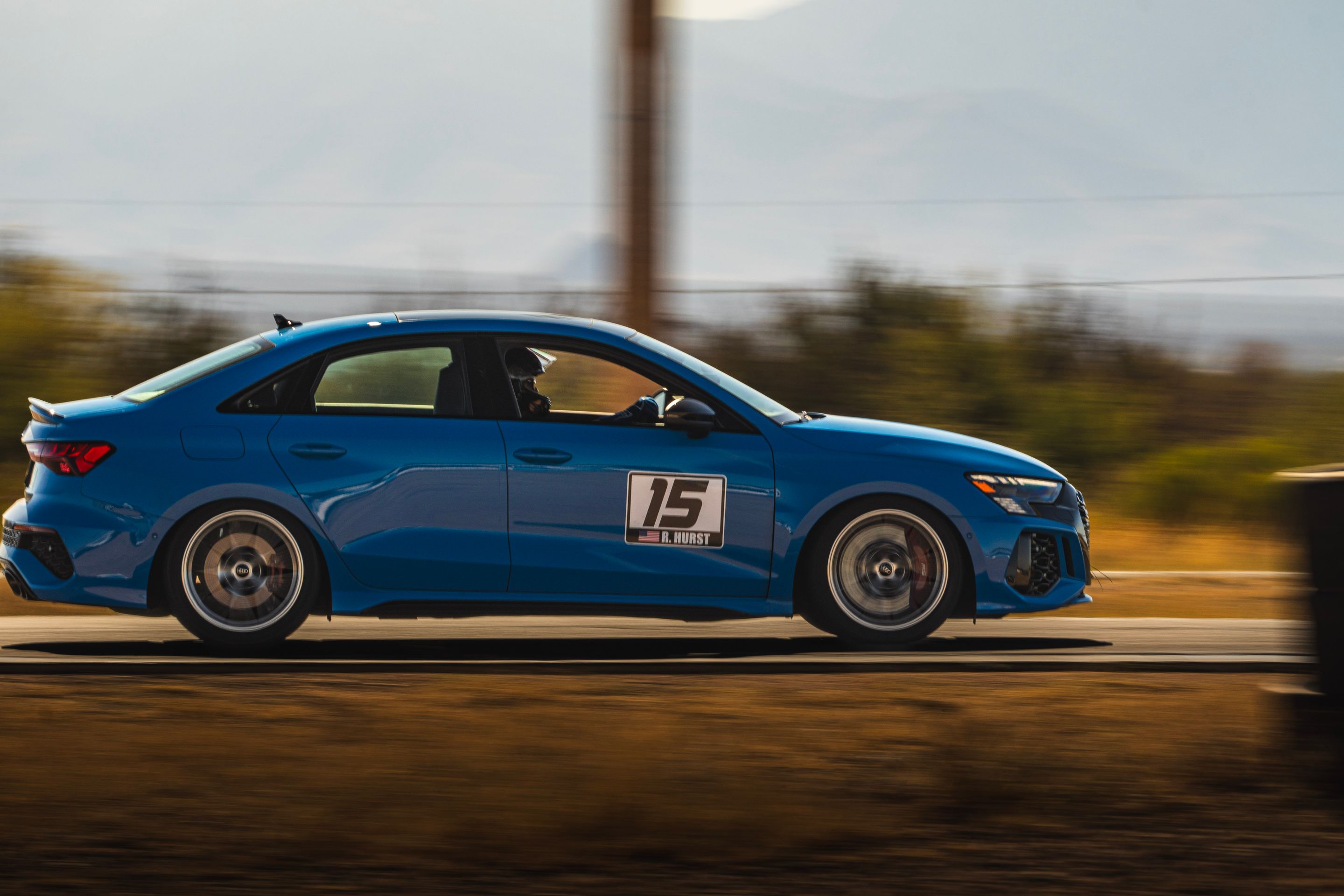 Blue Audi 8Y RS 3 with 18" VS-5RS Apex wheels in Brushed Clear