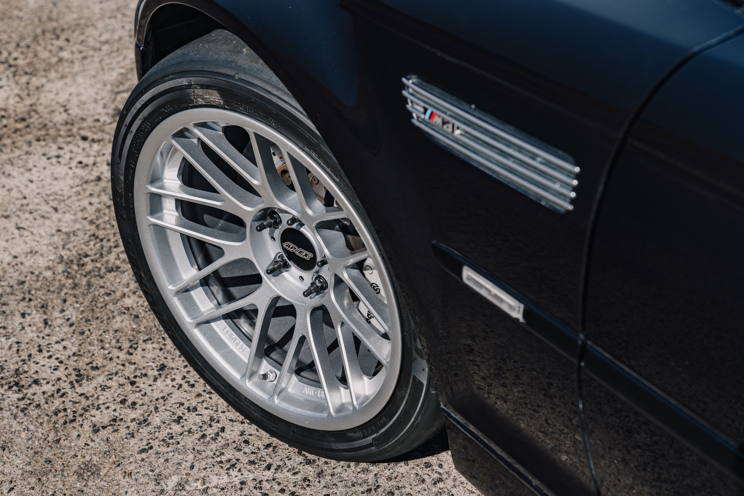 Black BMW E46 M3 with 18" ARC-8RT Apex wheels in Race Silver