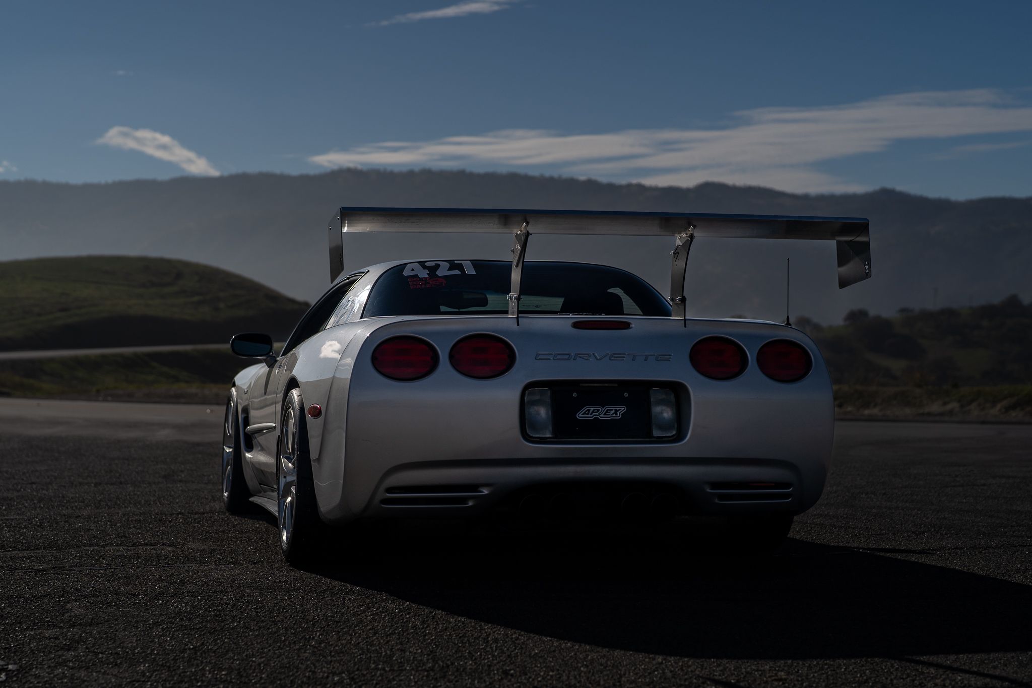 Silver Chevrolet C5 Corvette Z06 with 18" VS-5RS Apex wheels in Brushed Clear