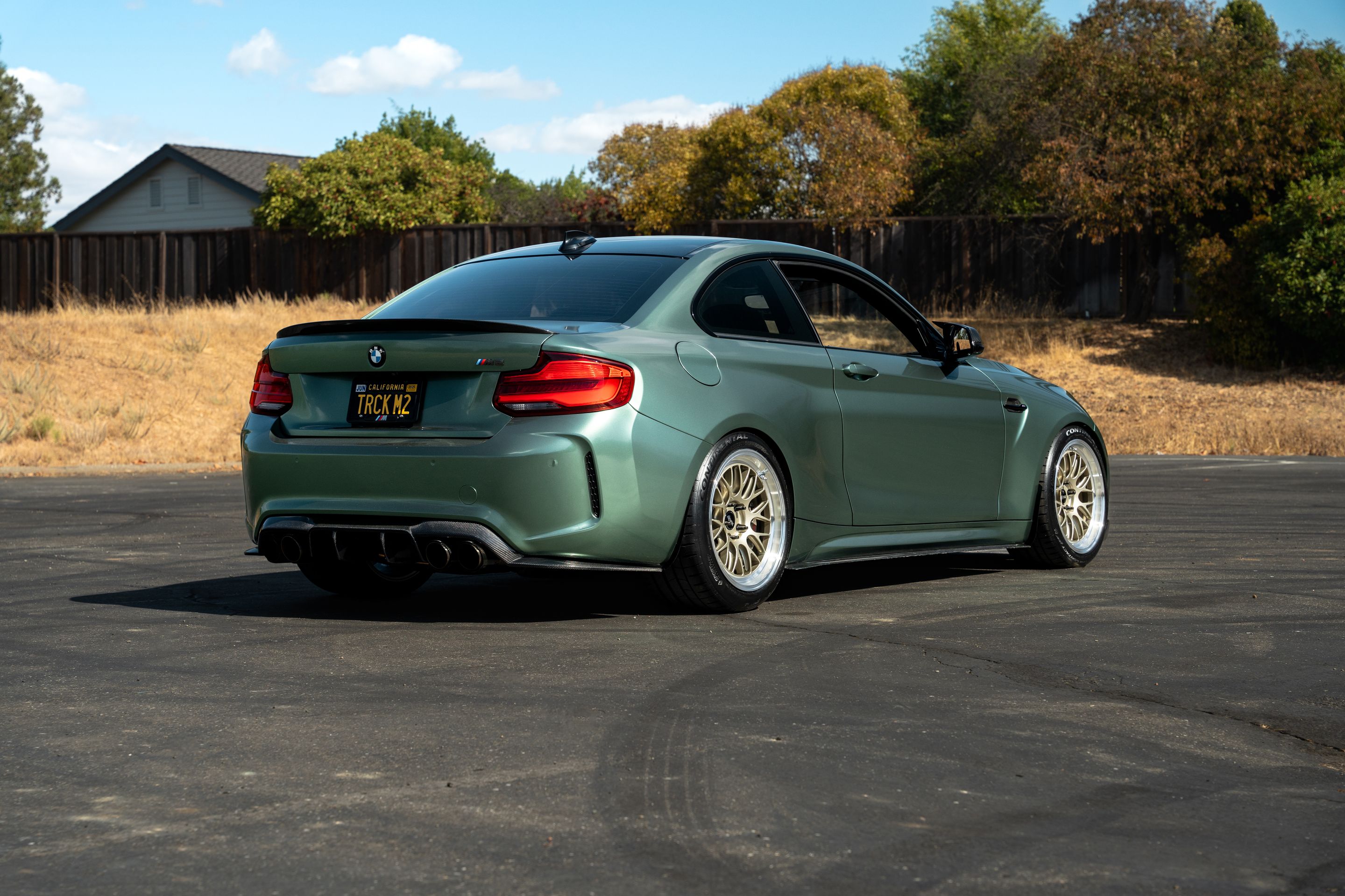 Green BMW F87 M2 with 18" ML-10RT Apex wheels in Machined Lip Gloss Motorsport Gold