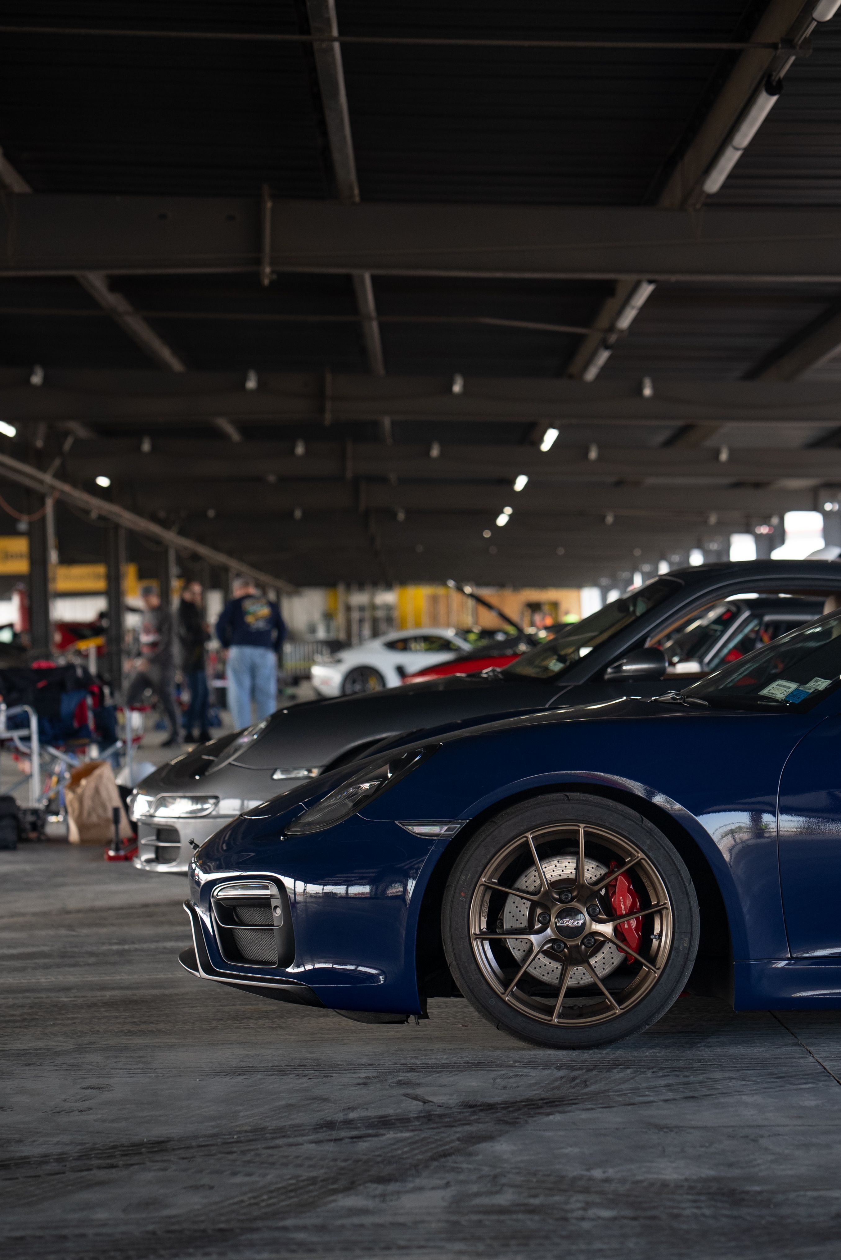 Blue Porsche 981 Cayman GTS with 18" VS-5RS Apex wheels in Satin Bronze