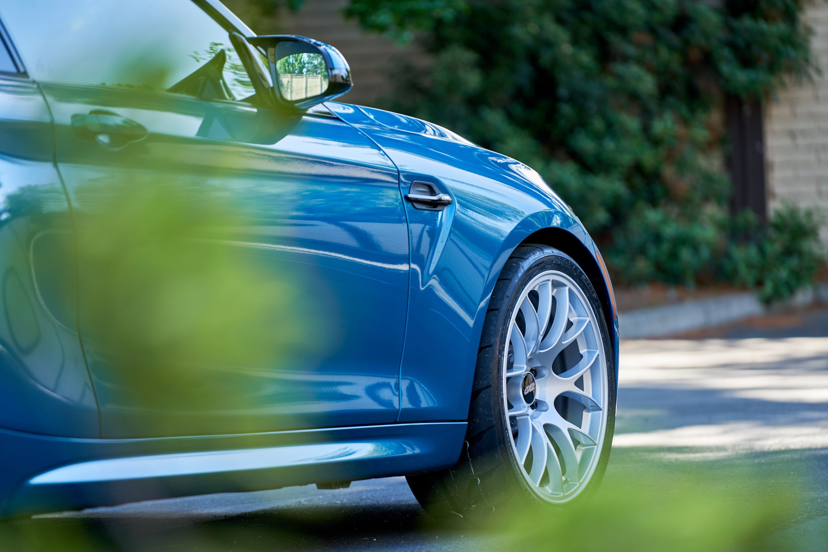 Blue BMW F87 M2 with 19" EC-7 Apex wheels in Race Silver