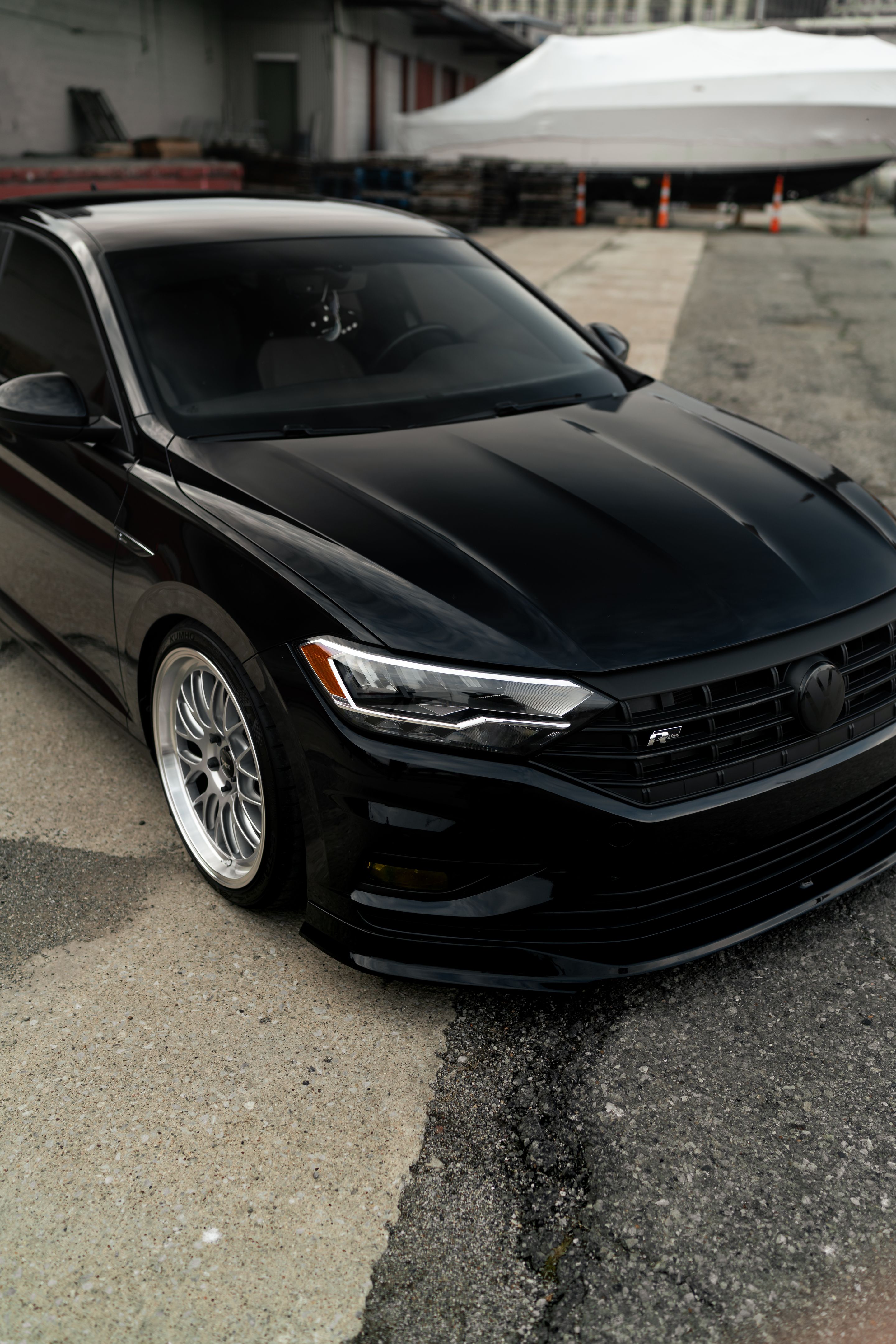 Black VW MK7 Jetta with 19" ML-10RT Apex wheels in Machined Lip Race Silver