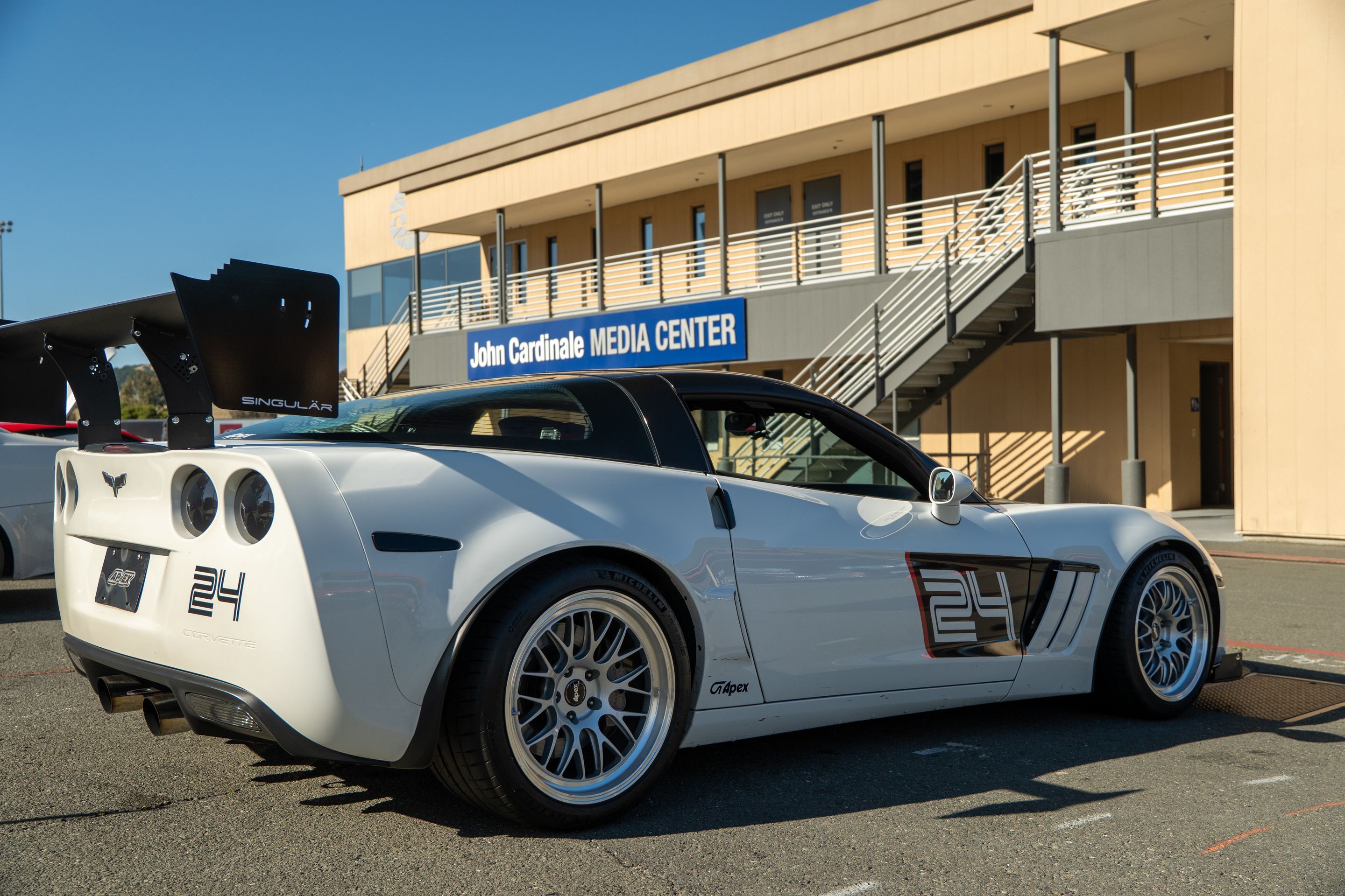 White Chevrolet C6 Corvette Grand Sport with 18"/19" ML-10RT Apex wheels in Machined Lip Race Silver