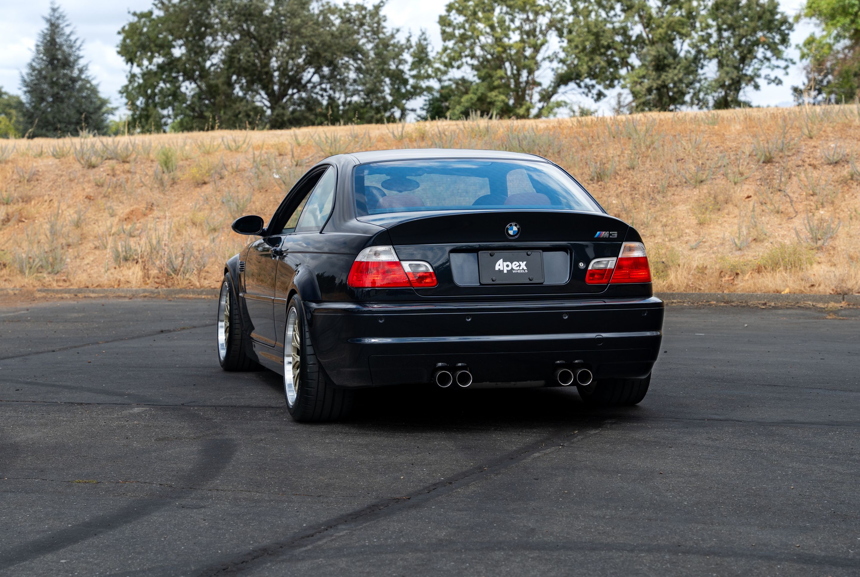 Black BMW E46 M3 with 18" ML-10RT Apex wheels in Machined Lip Gloss Motorsport Gold