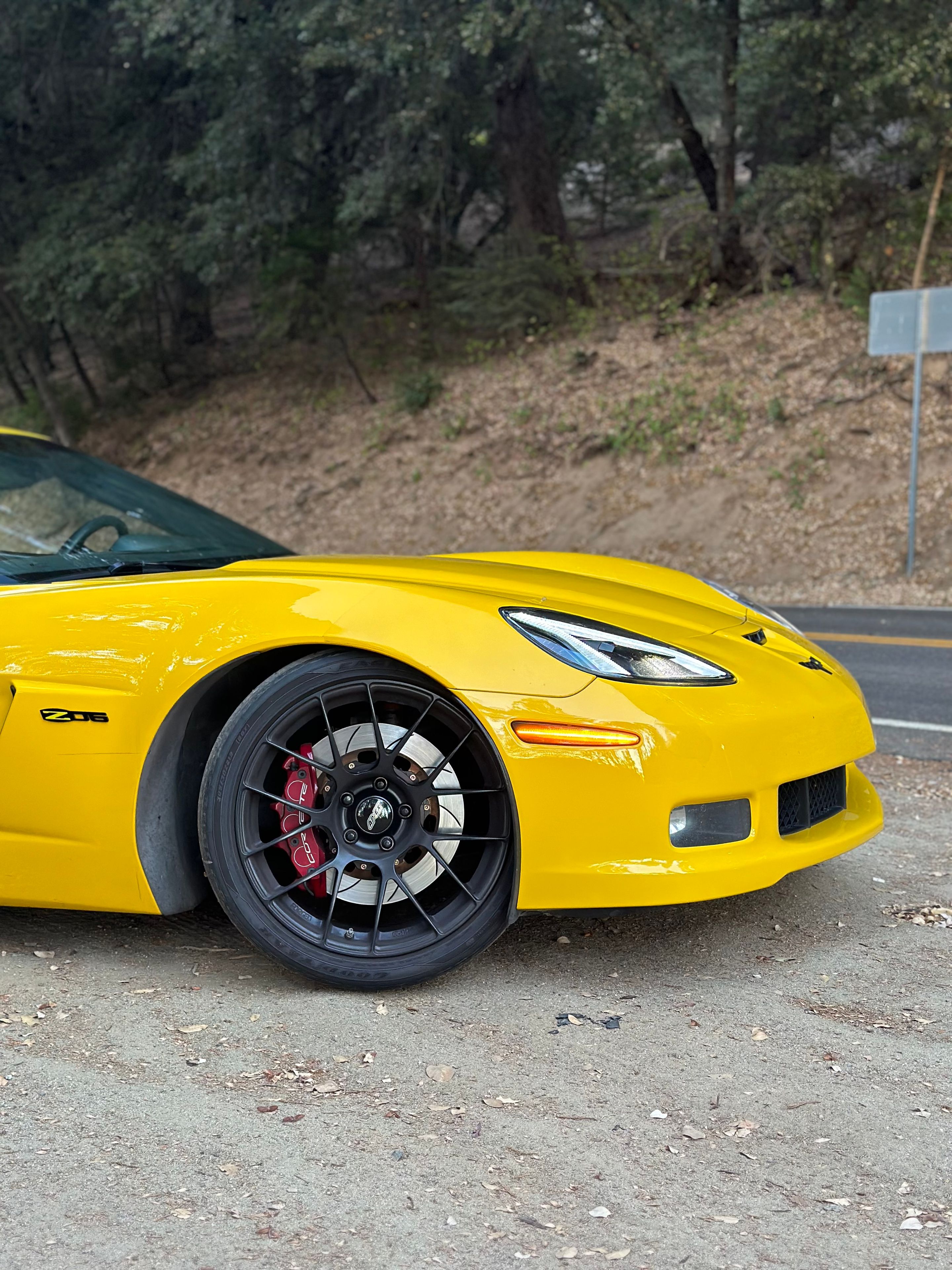 Yellow Chevrolet C6 Corvette Z06 with 19" EC-7RS Apex wheels in Satin Black