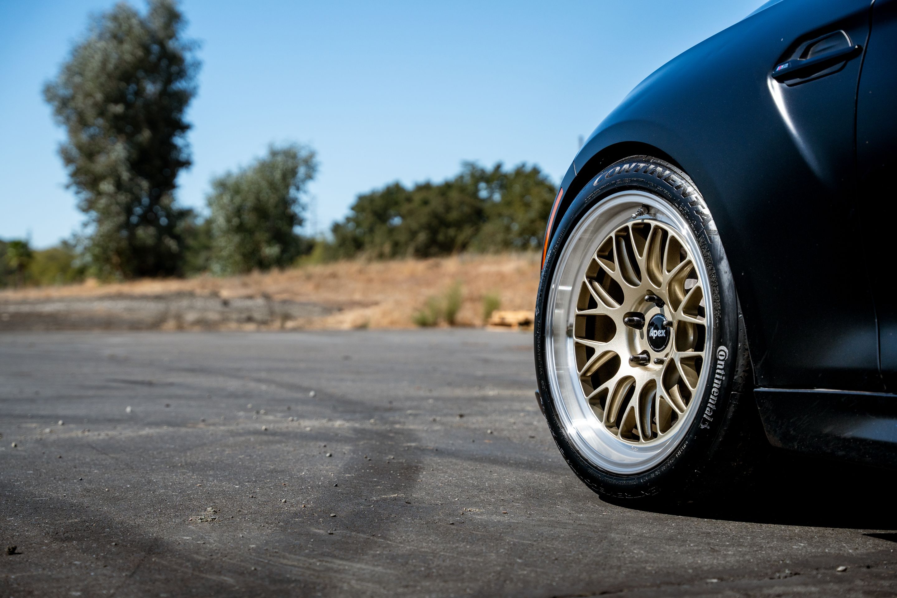 Black BMW F87 M2 with 18" ML-10RT Apex wheels in Machined Lip Gloss Motorsport Gold