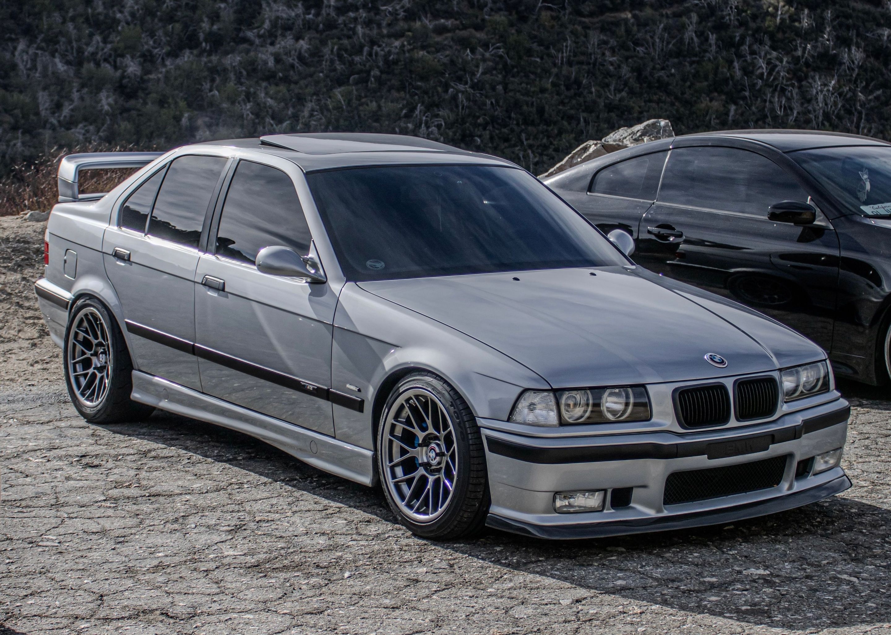 Silver BMW E36 M3 with 17" ARC-8 Apex wheels in Hyper Black