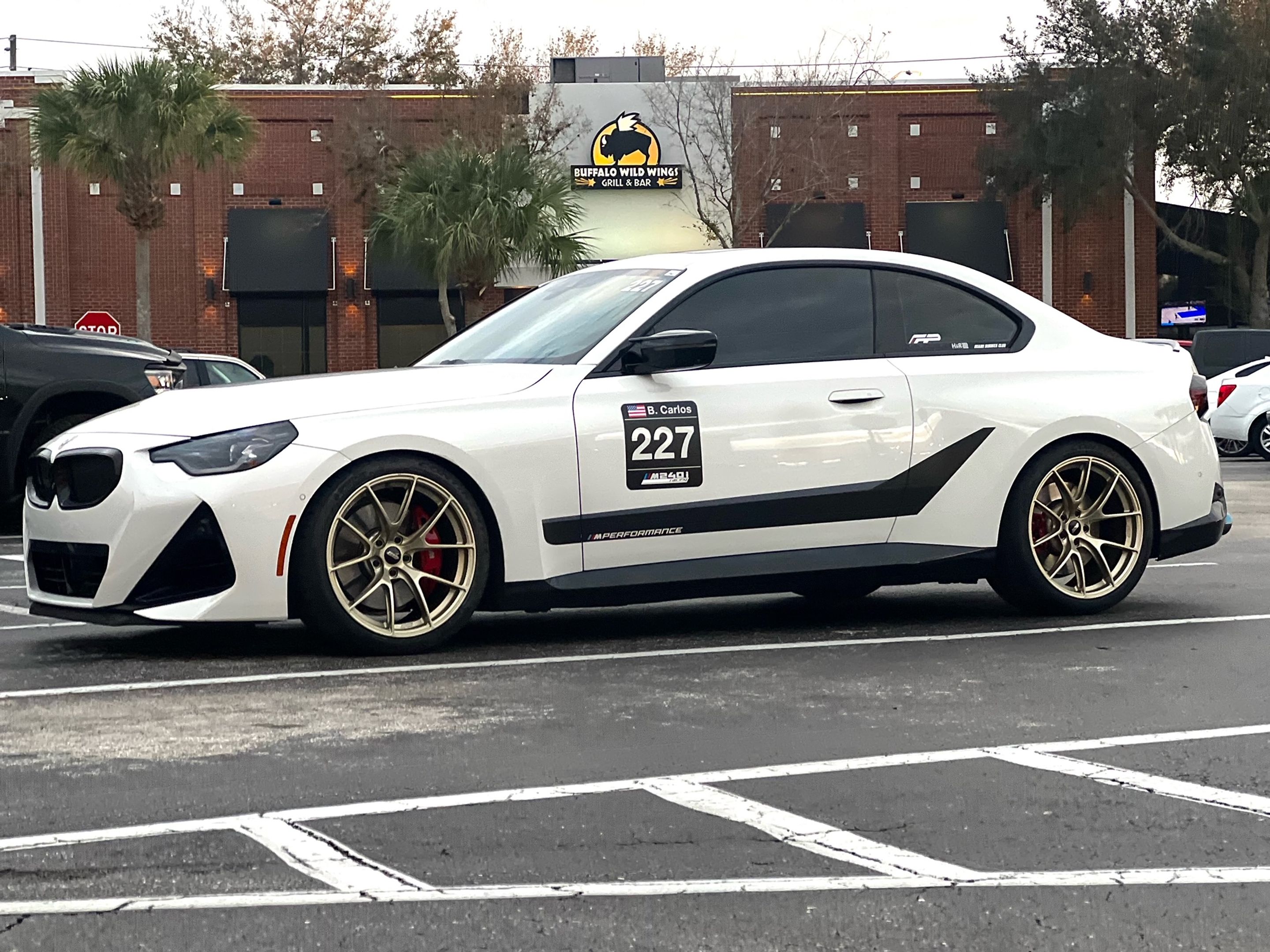 White BMW G42 2 Series with 19" VS-5RS Apex wheels in Motorsport Gold