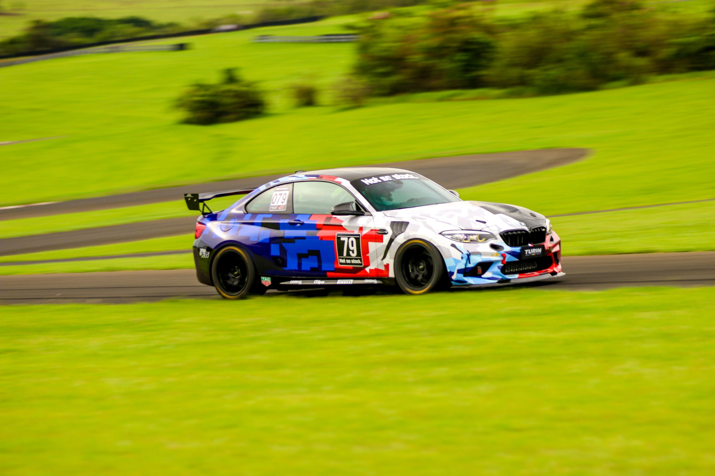 Multicolor BMW F87 M2 with 18" EC-7 Apex wheels in Satin Black