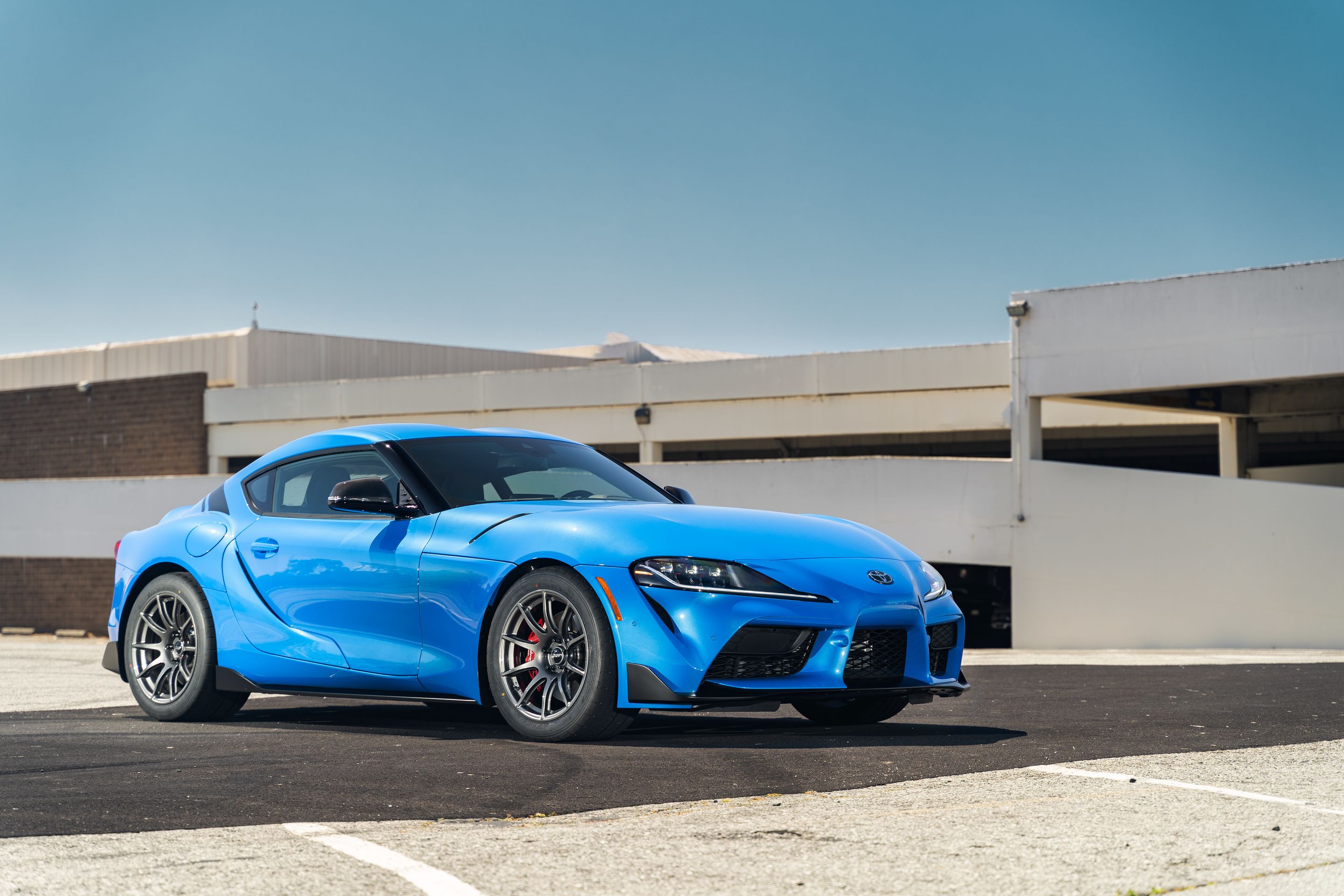 Blue Toyota GR Supra with 18" SM-10 Apex wheels in Anthracite
