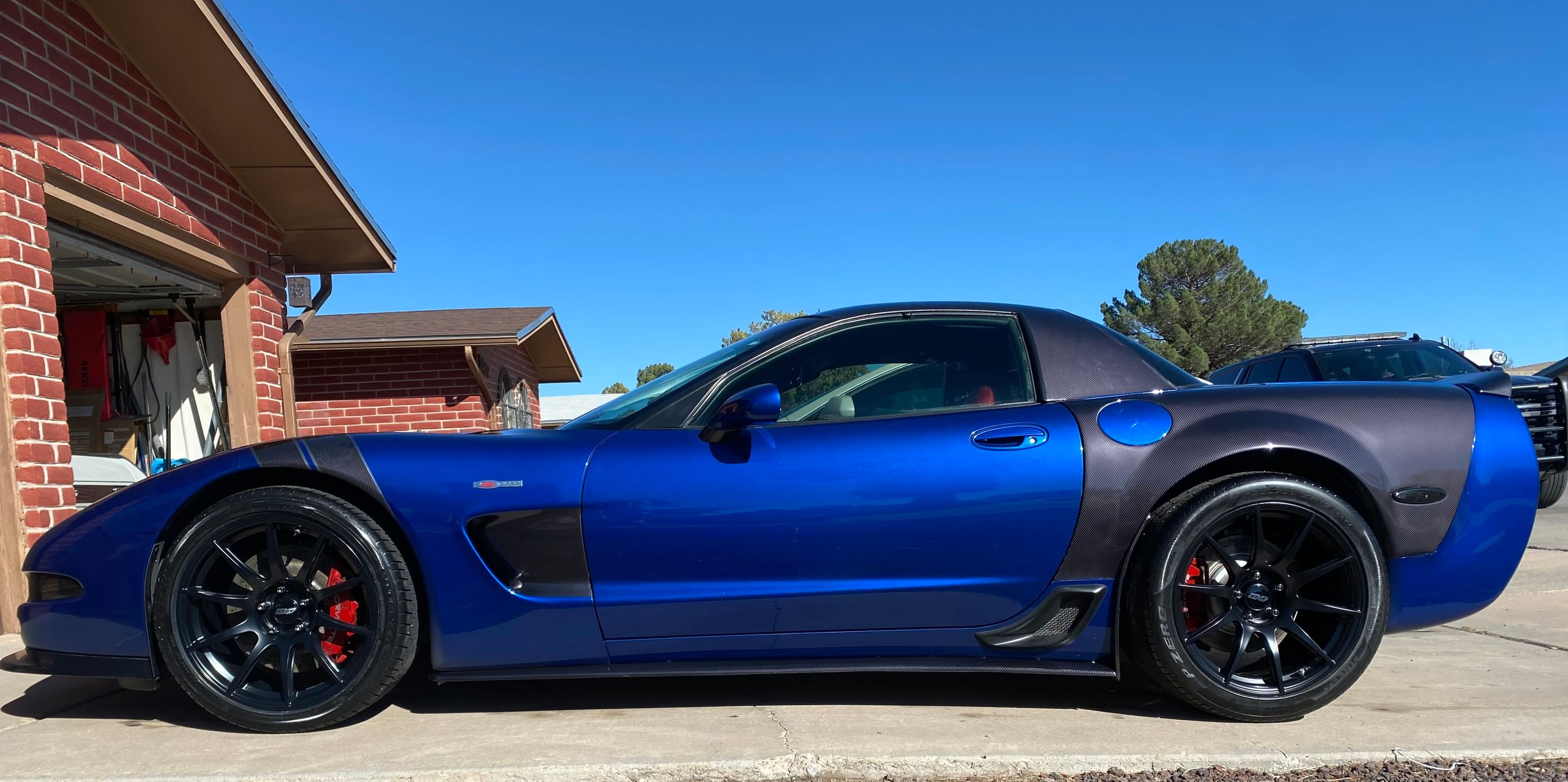 Blue Chevrolet C5 Corvette Z06 with 19" SM-10 Apex wheels in Satin Black