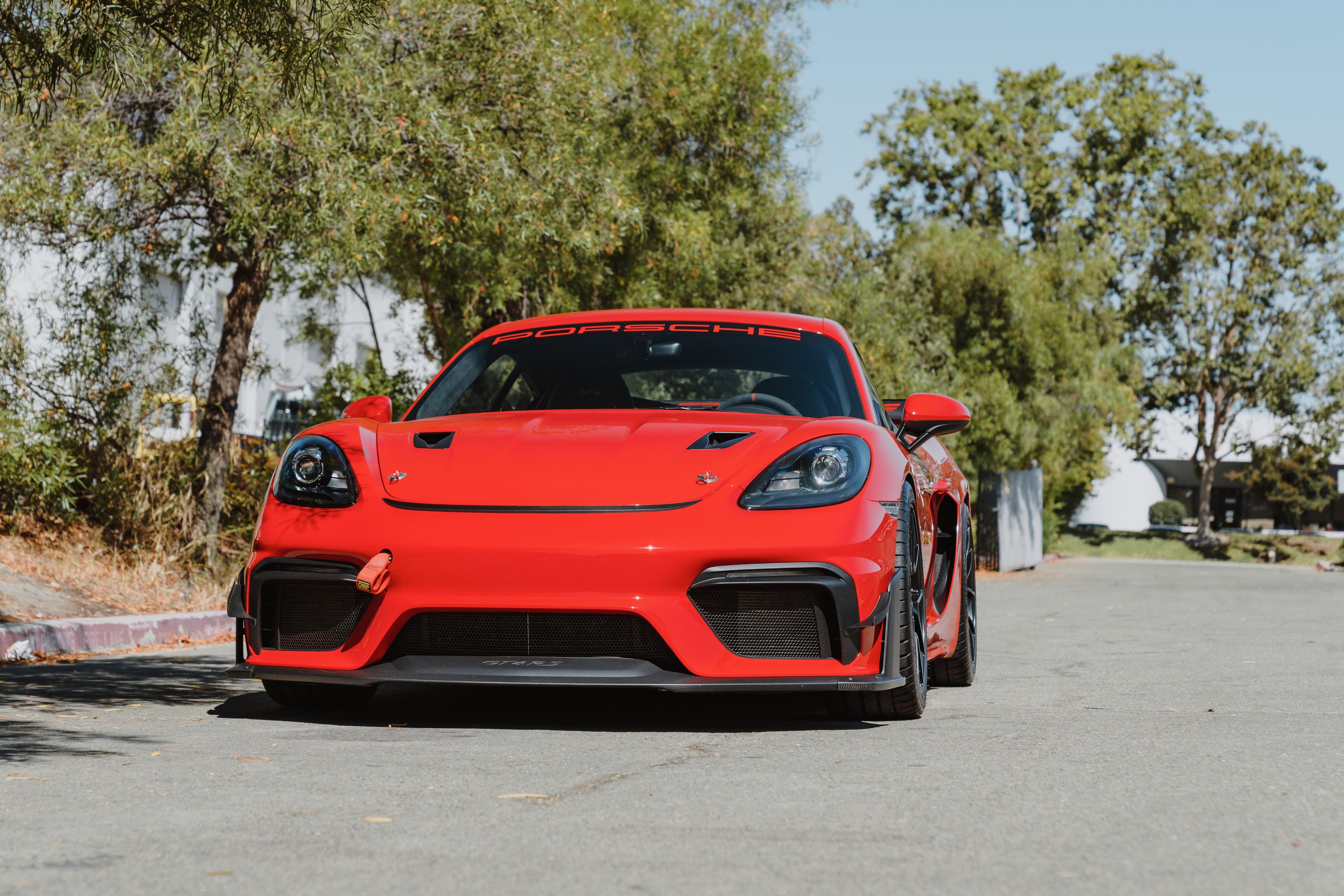 Red Porsche 718 Cayman GT4 with 19" VS-5RS Apex wheels in Satin Black