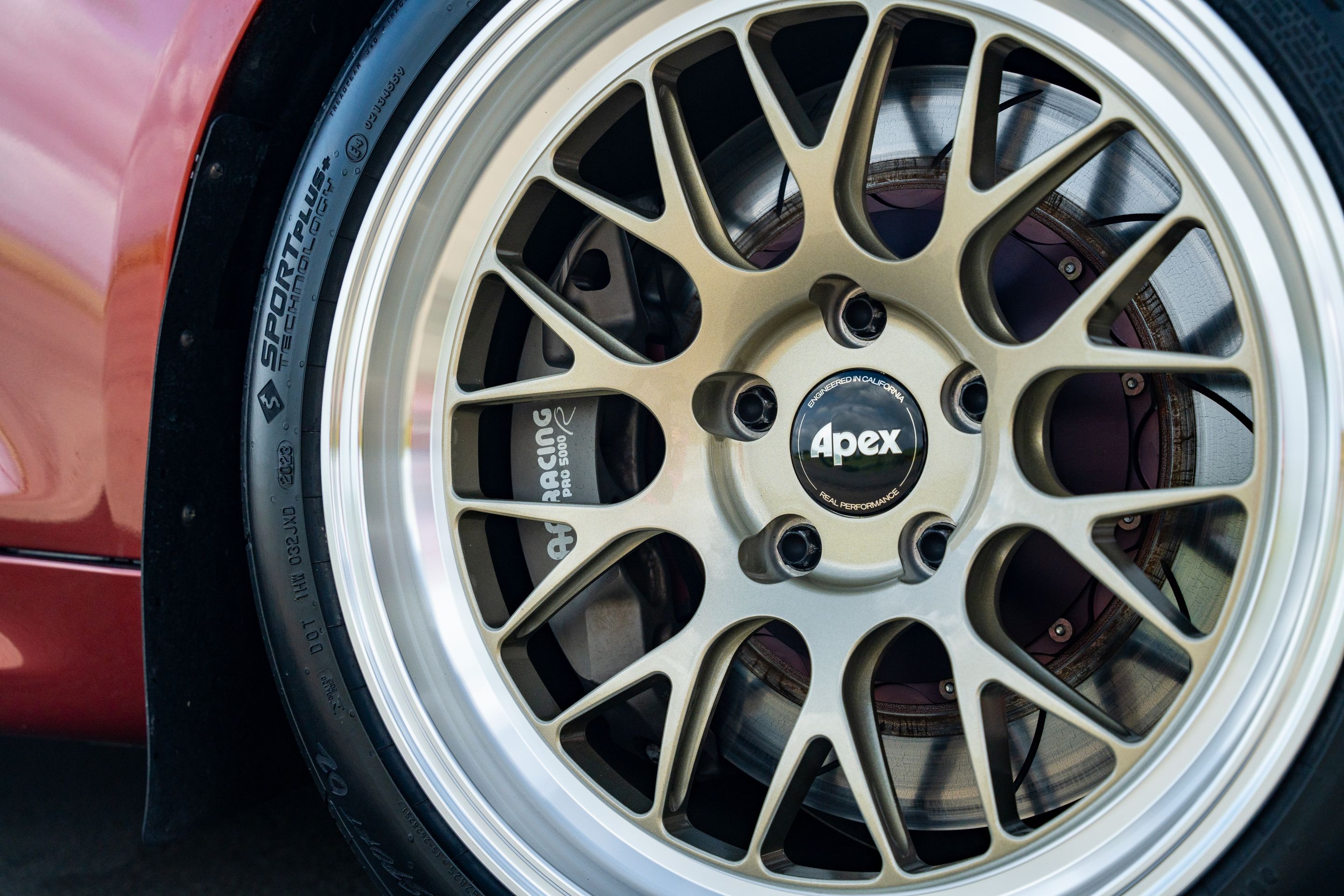 Orange BMW F87 M2 with 18" ML-10RT Apex wheels in Machined Lip Gloss Motorsport Gold