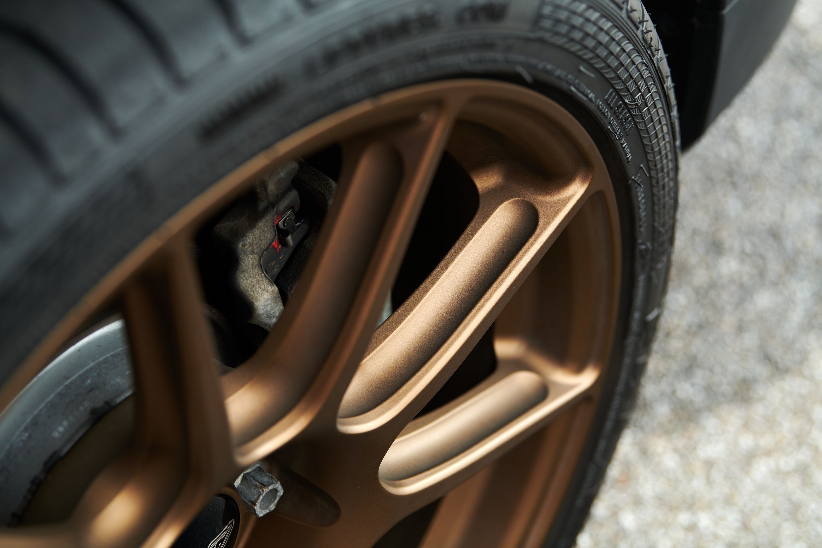 Red VW MK7 Alltrack/SportWagen Alltrack with 18" SM-10 Apex wheels in Satin Bronze