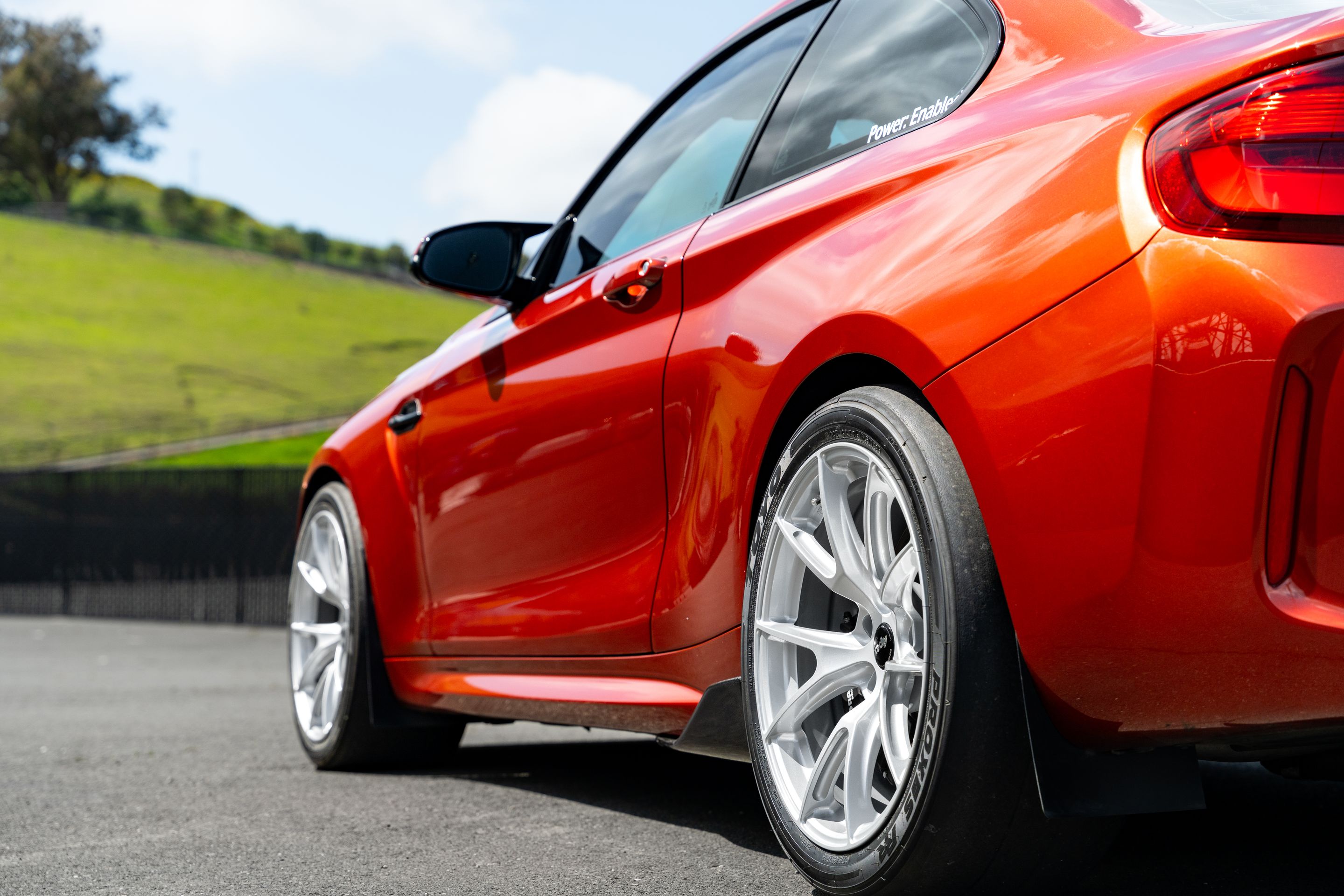 Orange BMW F87 M2 with 18" VS-5 Apex wheels in Race Silver