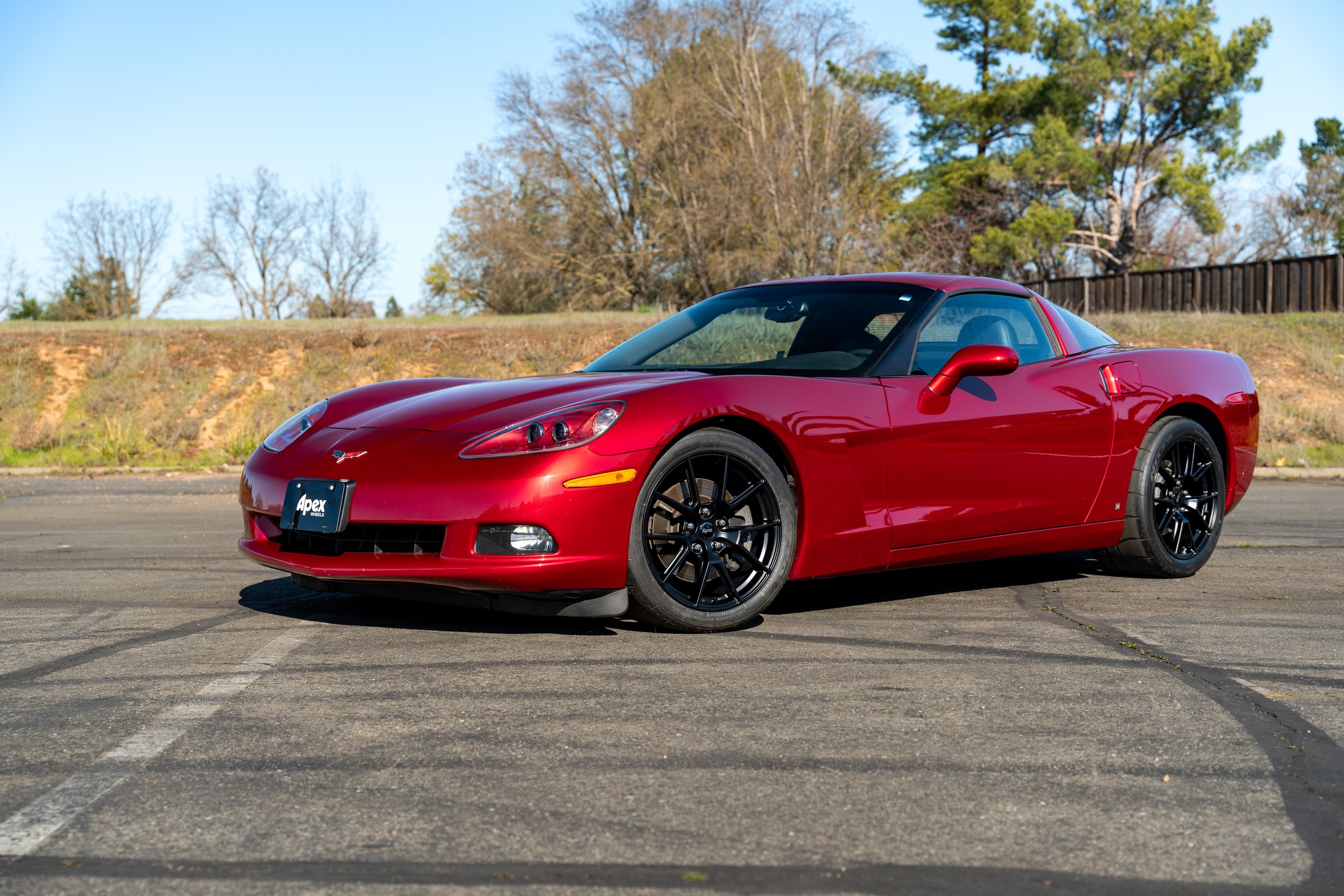 Red Chevrolet C6 Corvette Base/Z51 with 18" VS-5 Apex wheels in Satin Black