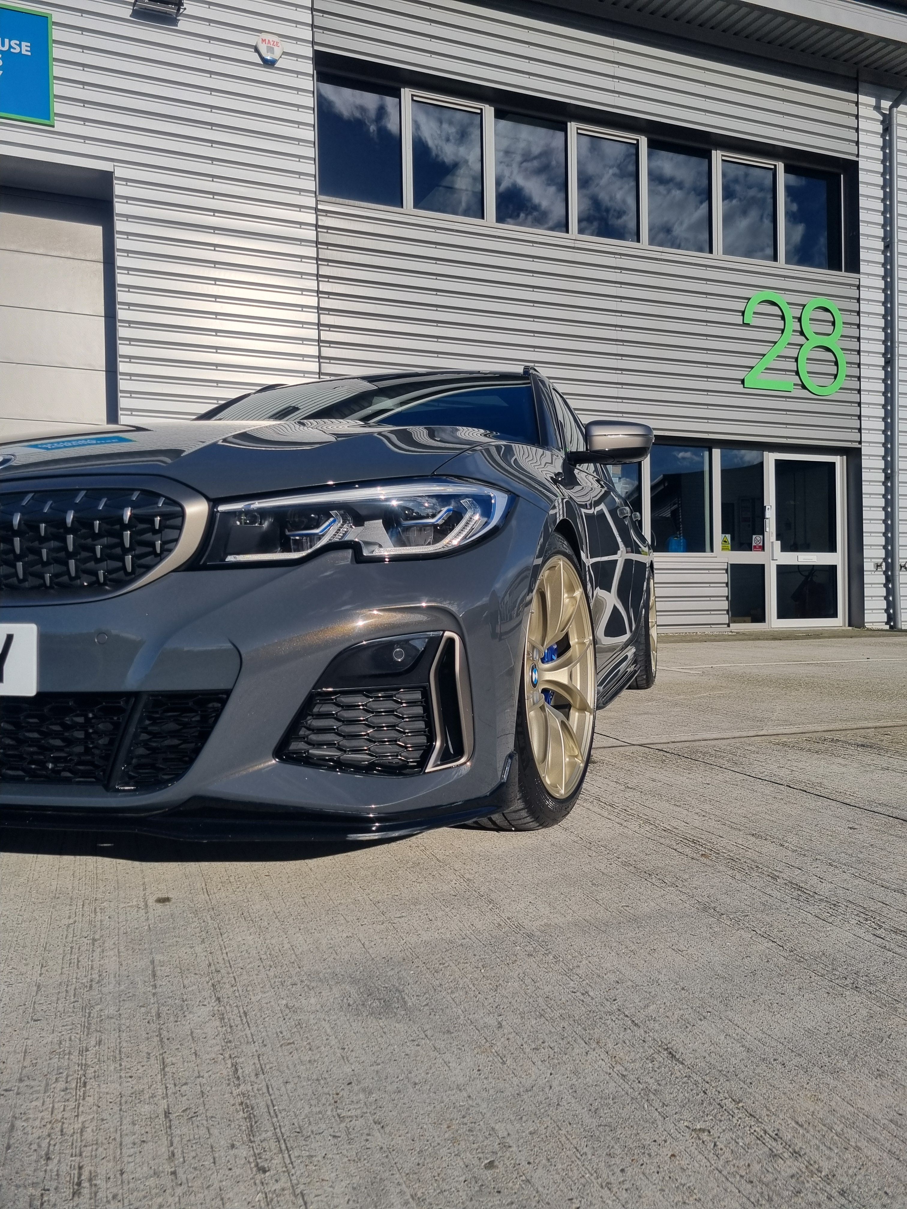 Black BMW G21 Wagon 3 Series with 19" VS-5RS Apex wheels in Motorsport Gold