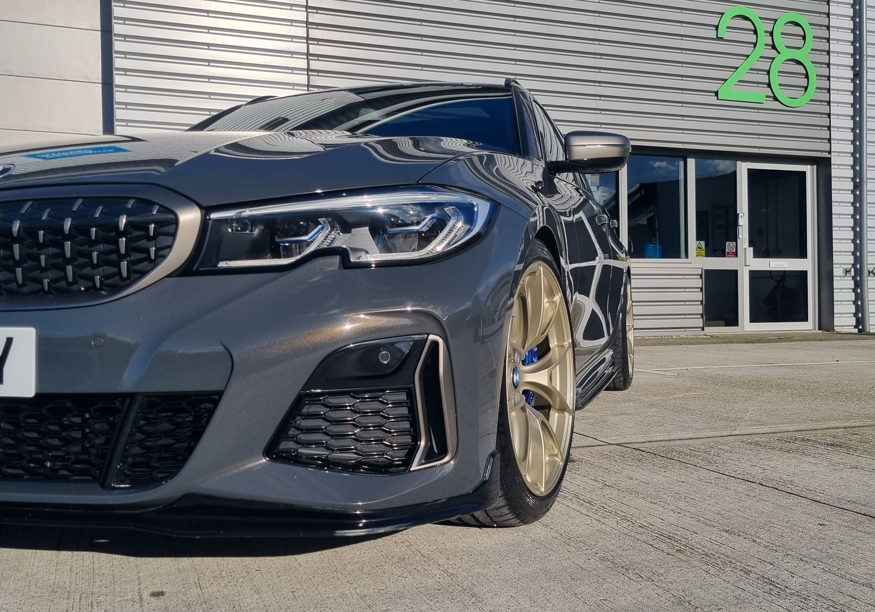 Black BMW G21 Wagon 3 Series with 19" VS-5RS Apex wheels in Motorsport Gold