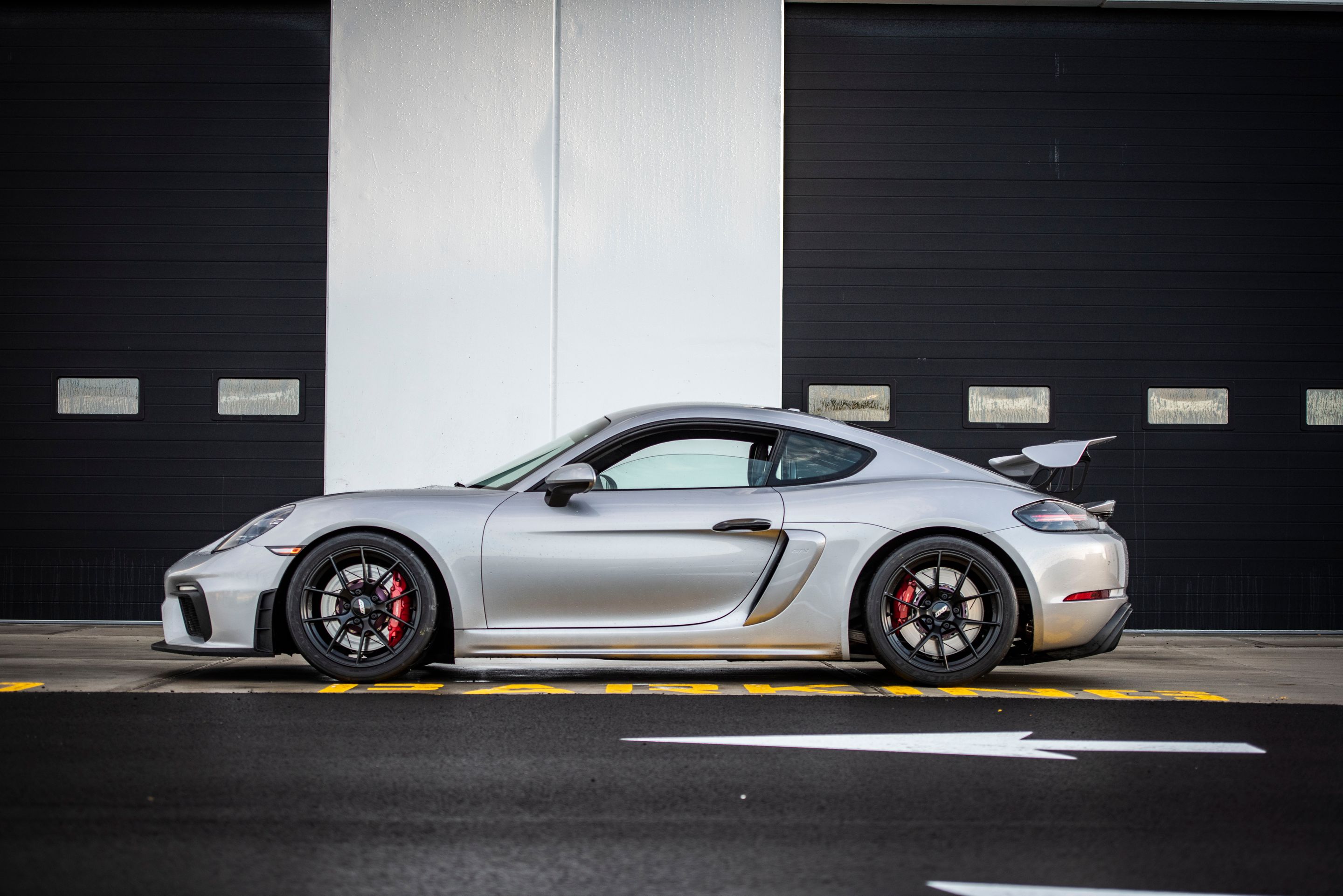 Silver Porsche 718 Cayman GT4 with 19" VS-5RS Apex wheels in Satin Black