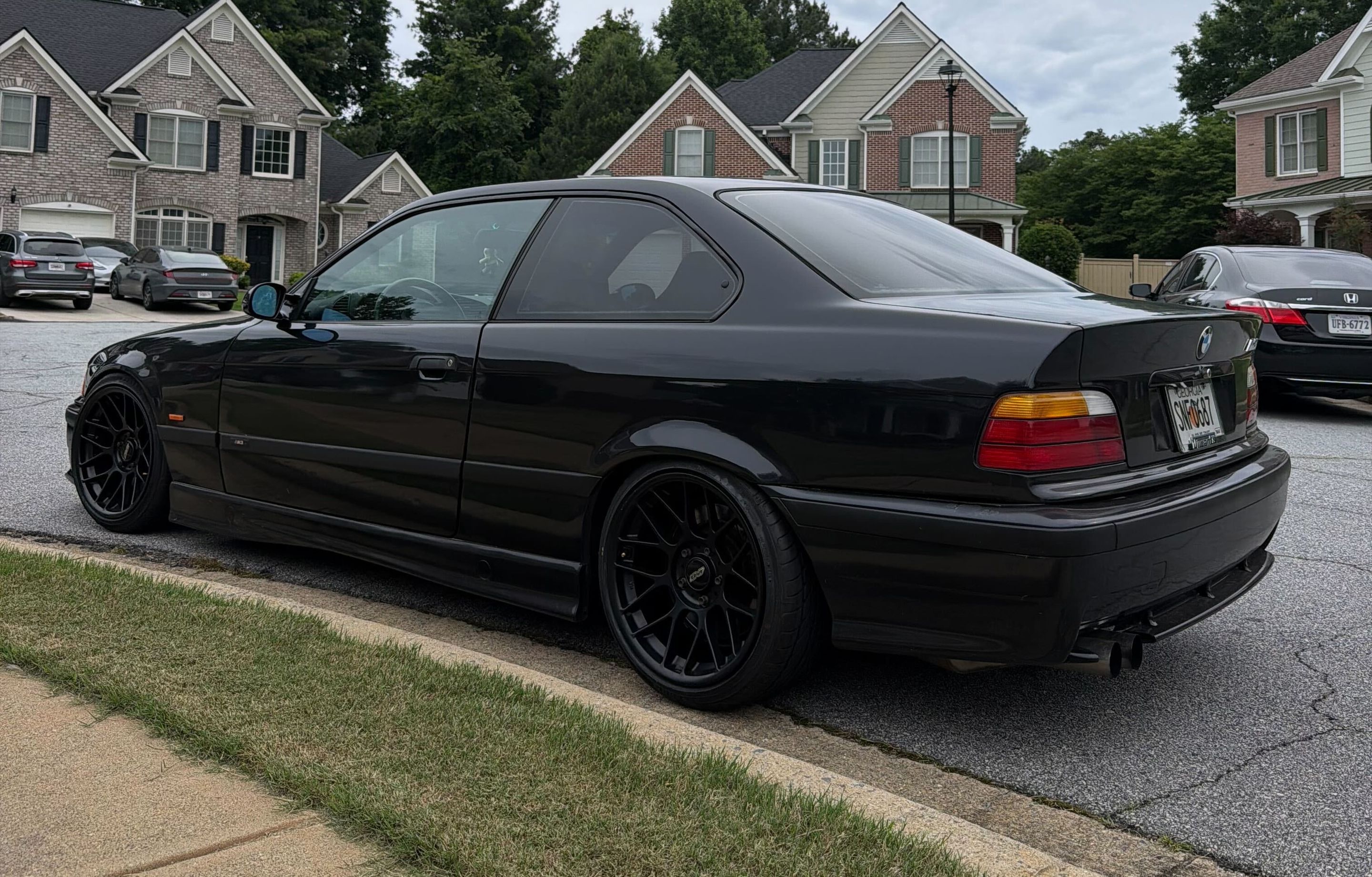 Black BMW E36 M3 with 17" ARC-8 Apex wheels in Satin Black