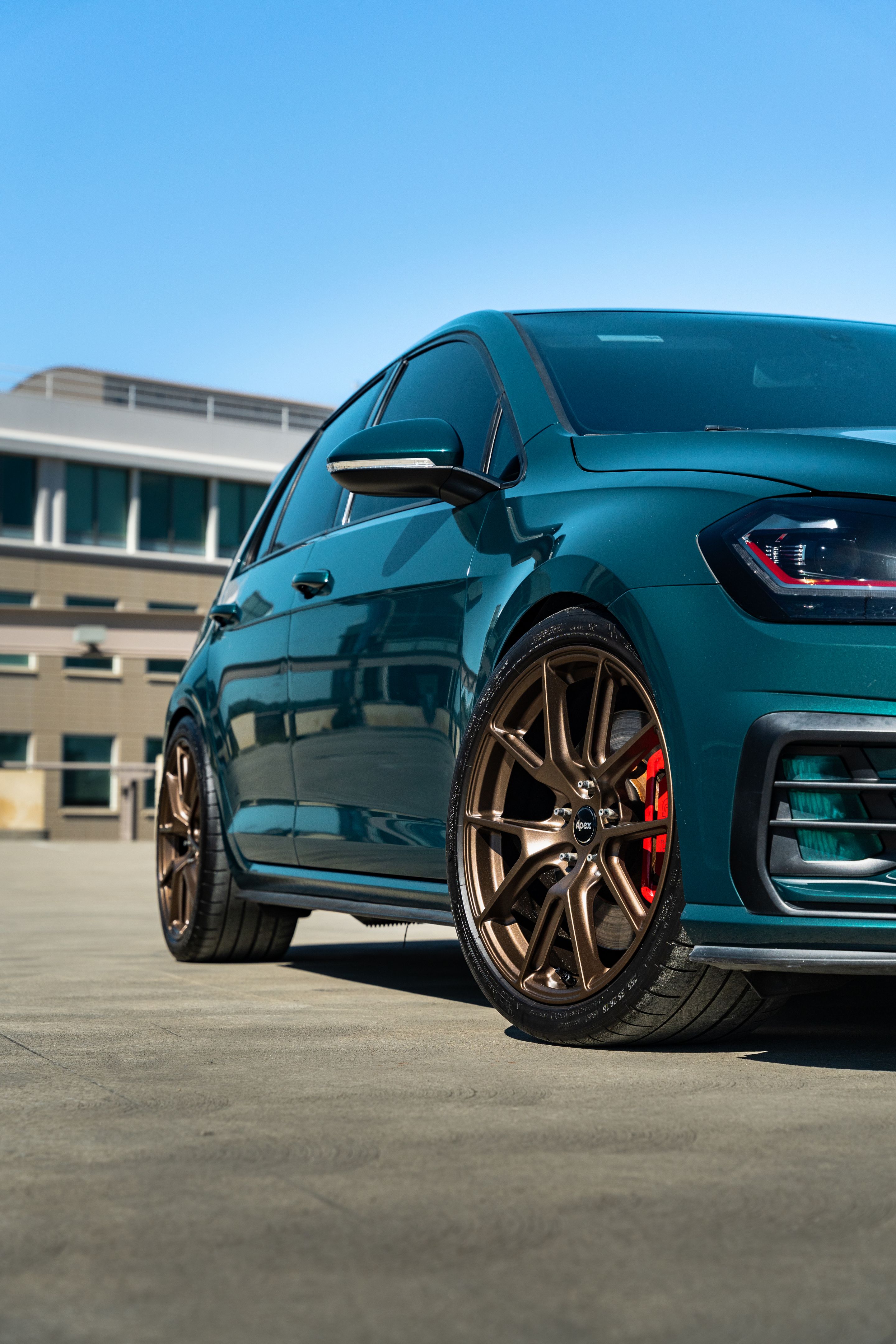 Green VW MK7 GTI with 18" VS-5 Apex wheels in Satin Bronze