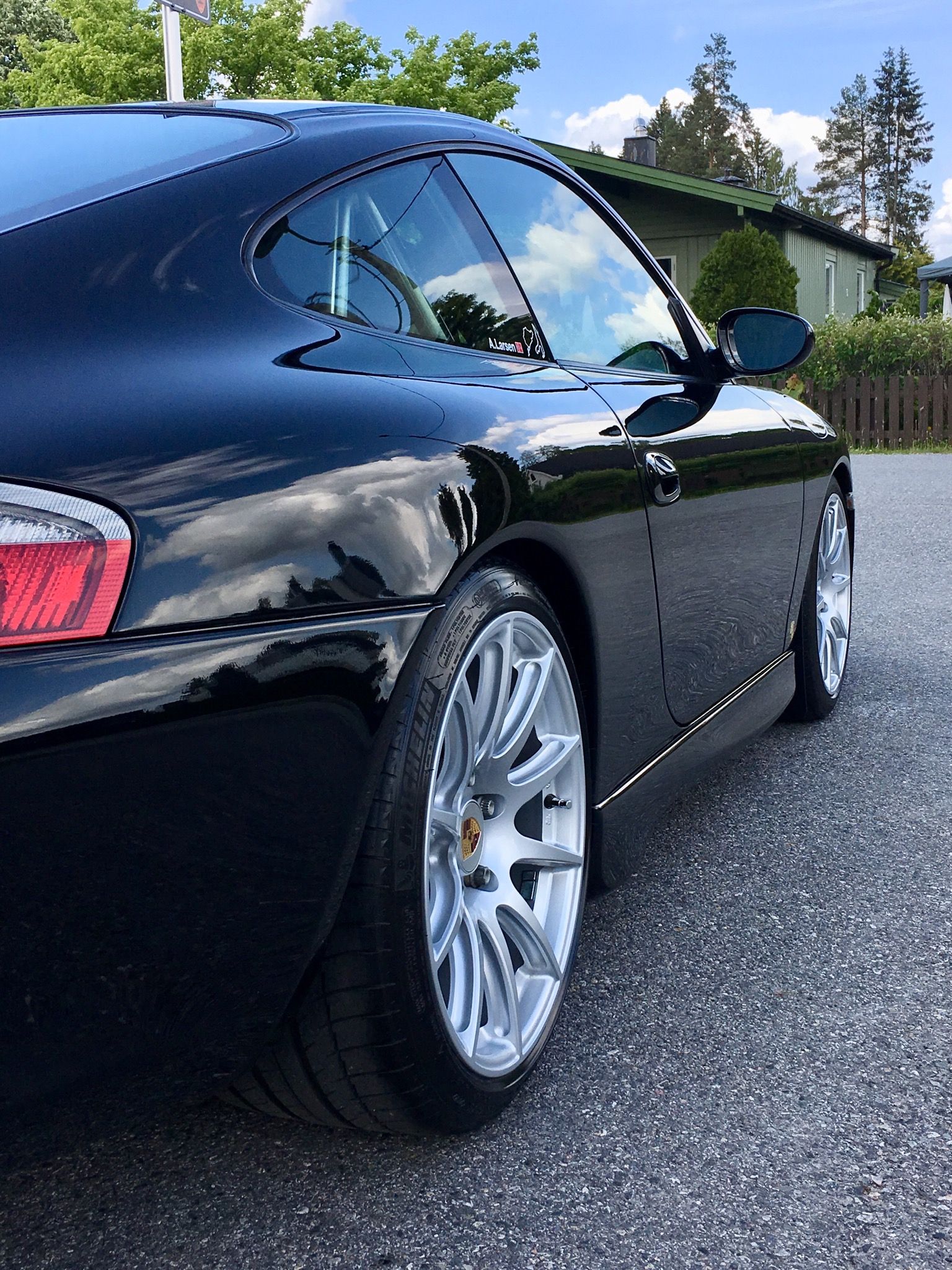 Black Porsche 911 996 Carrera with 18" SM-10 Apex wheels in Race Silver