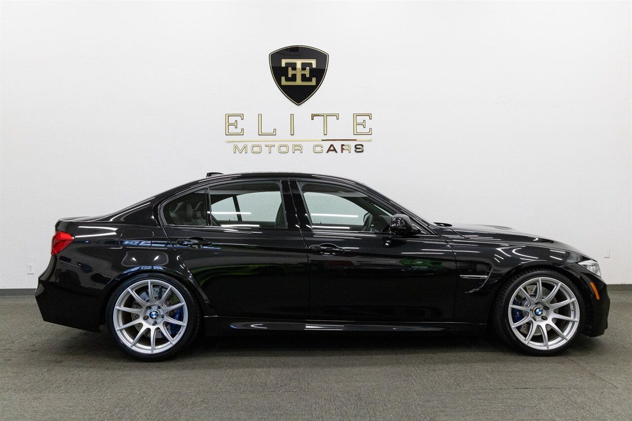 Black BMW F80 M3 with 19" SM-10 Apex wheels in Race Silver