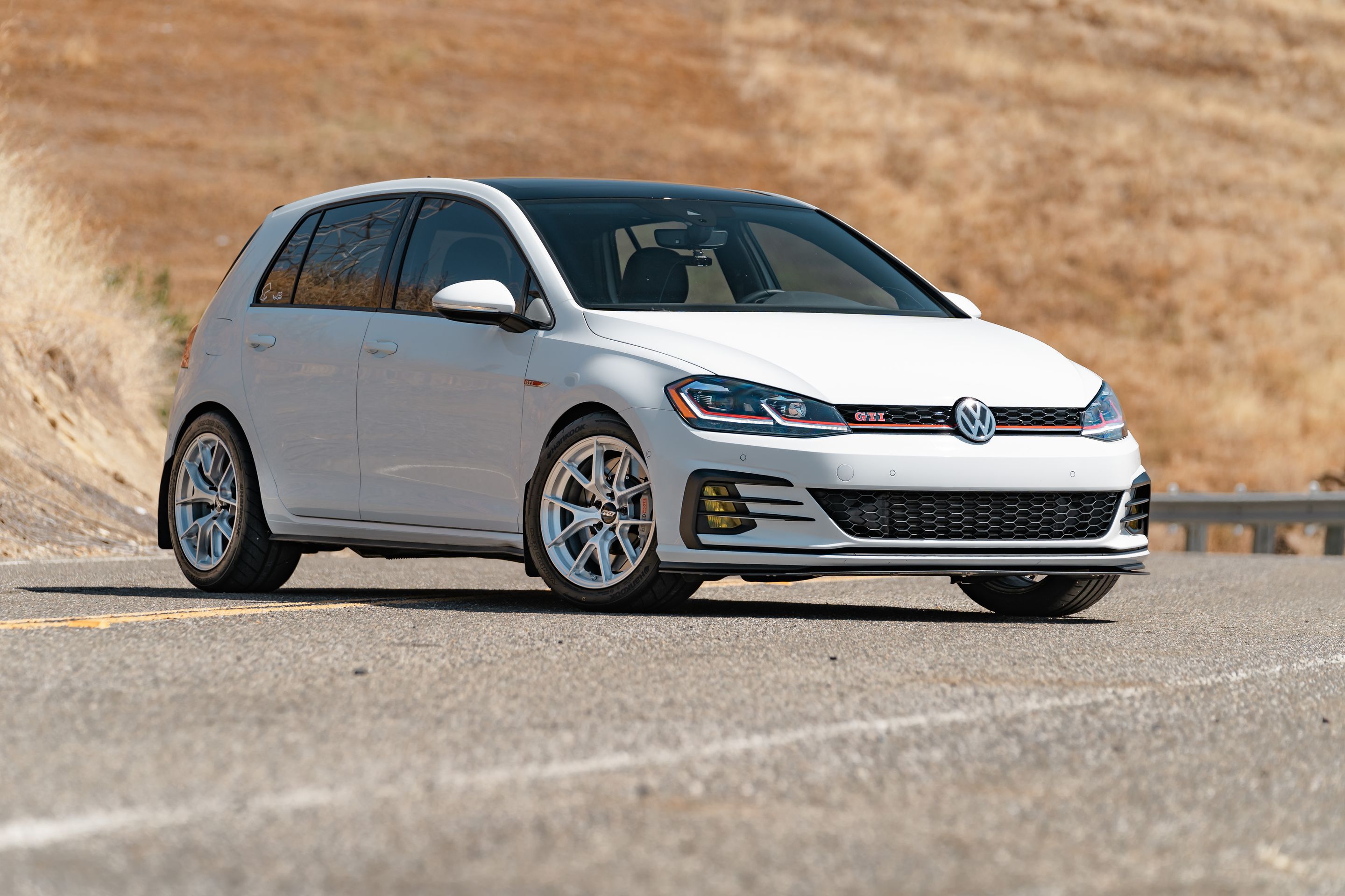 White VW MK7 GTI with 17" VS-5RS Apex wheels in Brushed Clear