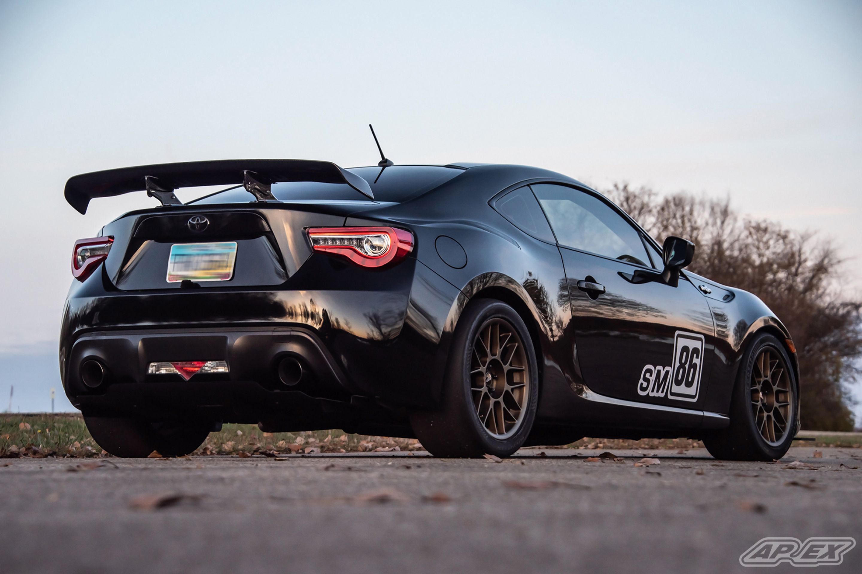 Black Scion FR-S with 17" ARC-8 Apex wheels in Satin Bronze