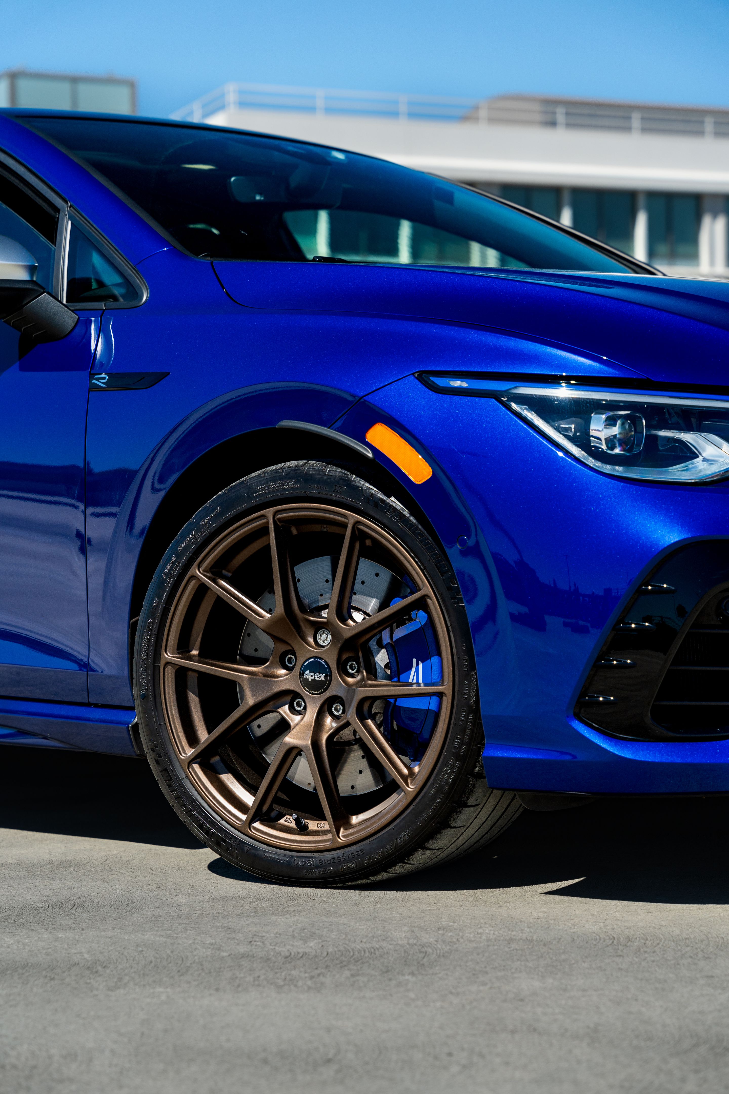 Blue VW MK8 Golf R with 18" VS-5 Apex wheels in Satin Bronze