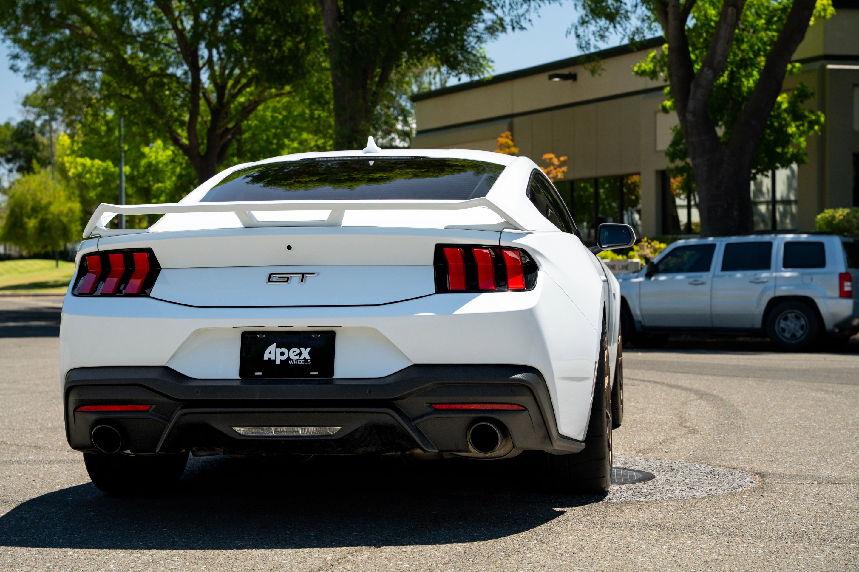White Ford S650 Mustang GT with 18" VS-5RS Apex wheels in Satin Bronze