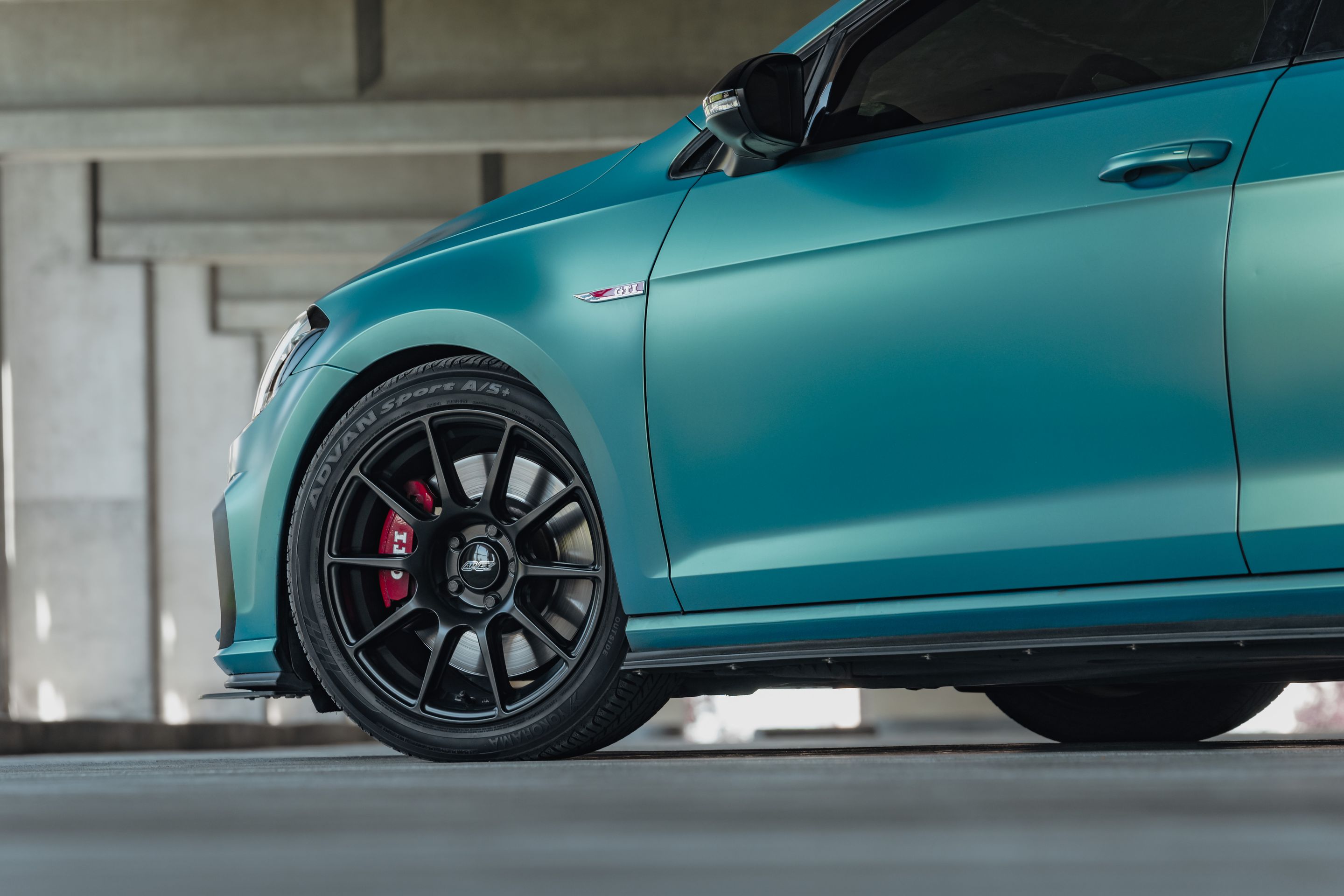 Green VW MK7 GTI with 17" SM-10 Apex wheels in Satin Black