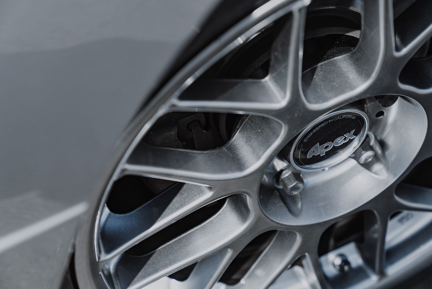 Silver BMW E30 M3 with 17" ARC-8 Apex wheels in Hyper Black