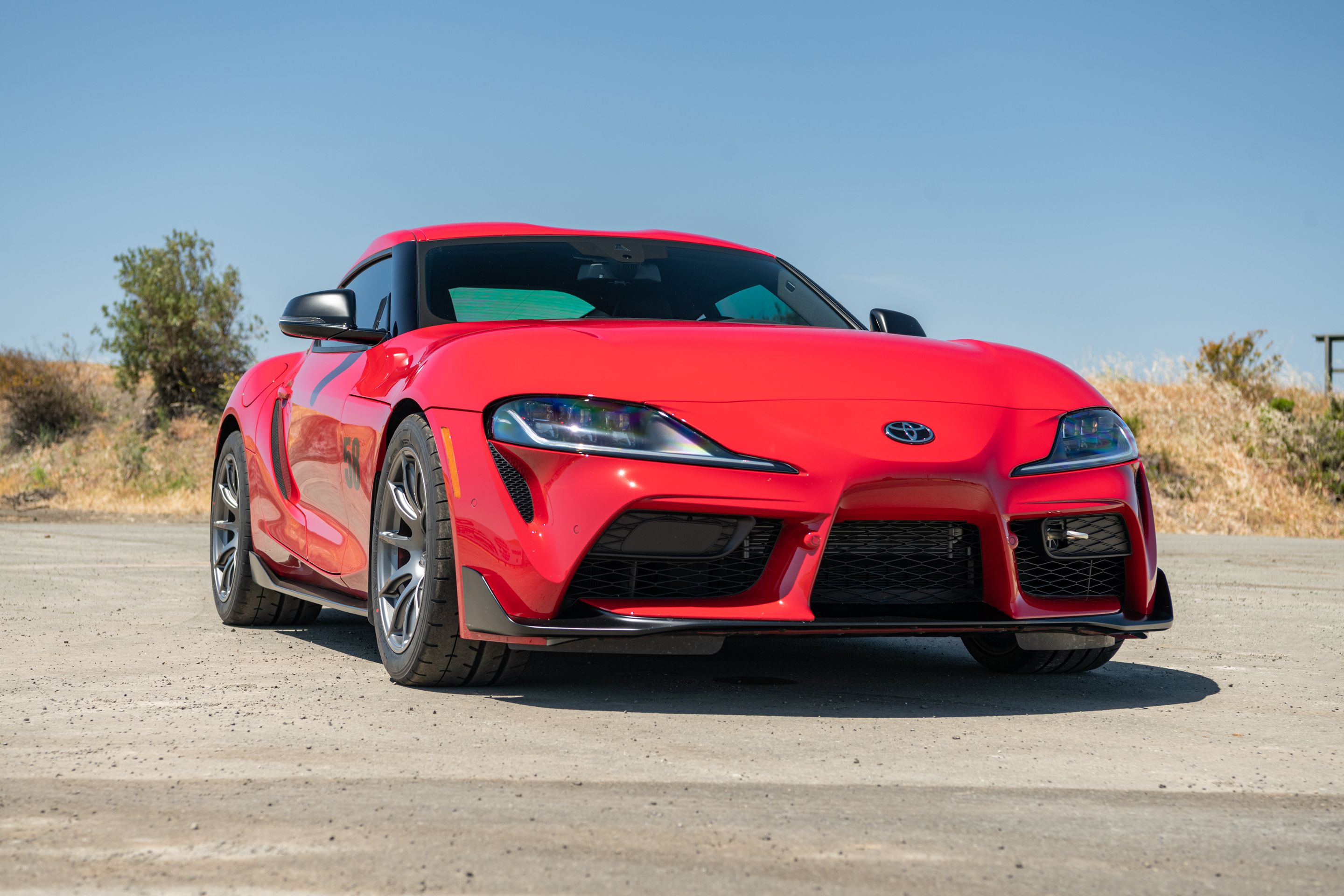 Red Toyota GR Supra with 18" SM-10 Apex wheels in Anthracite