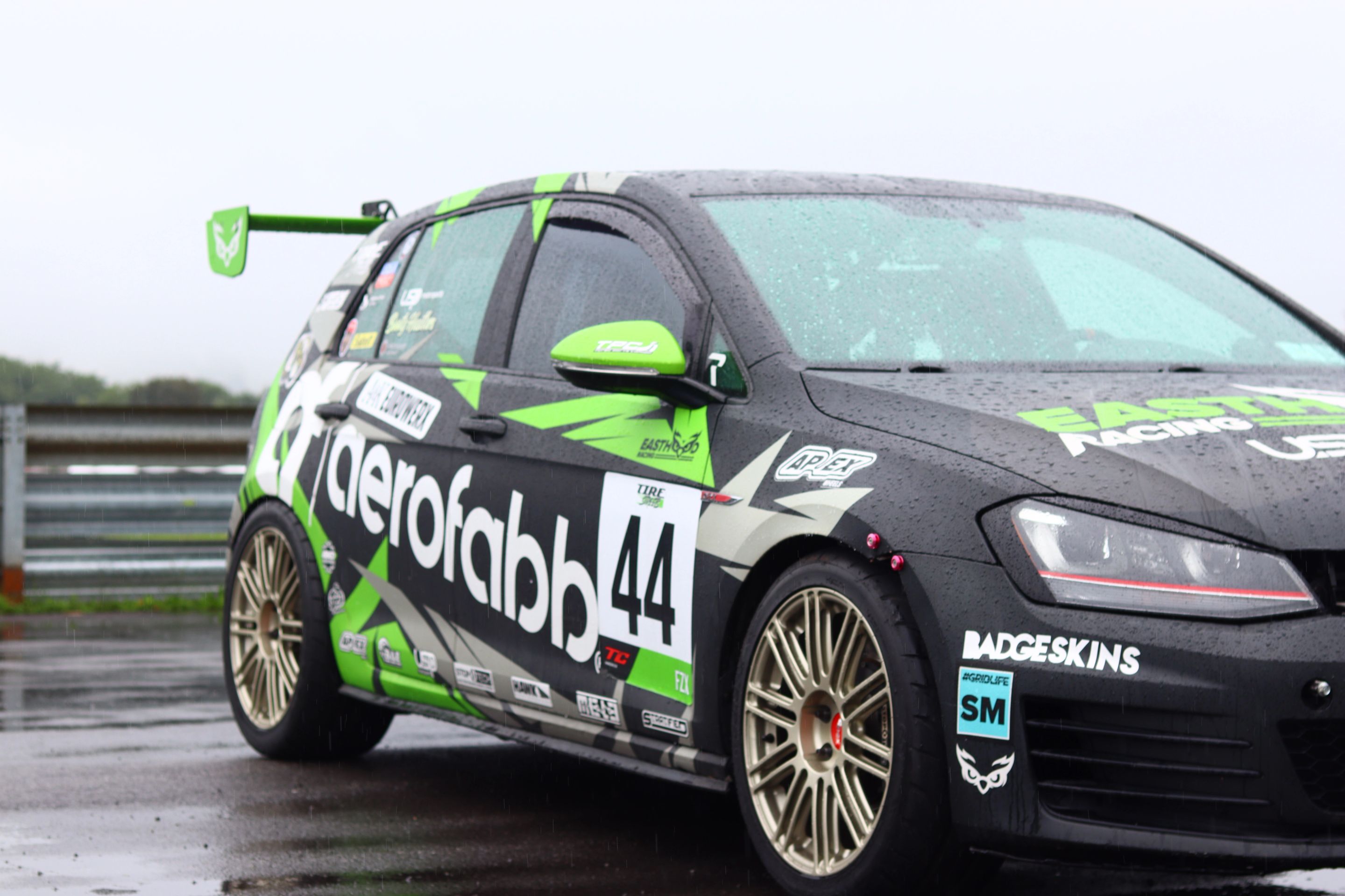 Race Livery VW MK7 GTI with 18" TC-10RT Apex wheels in Motorsport Gold