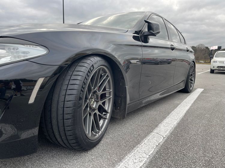 Black BMW F10 Sedan 5 Series with 19" ARC-8 Apex wheels in Anthracite