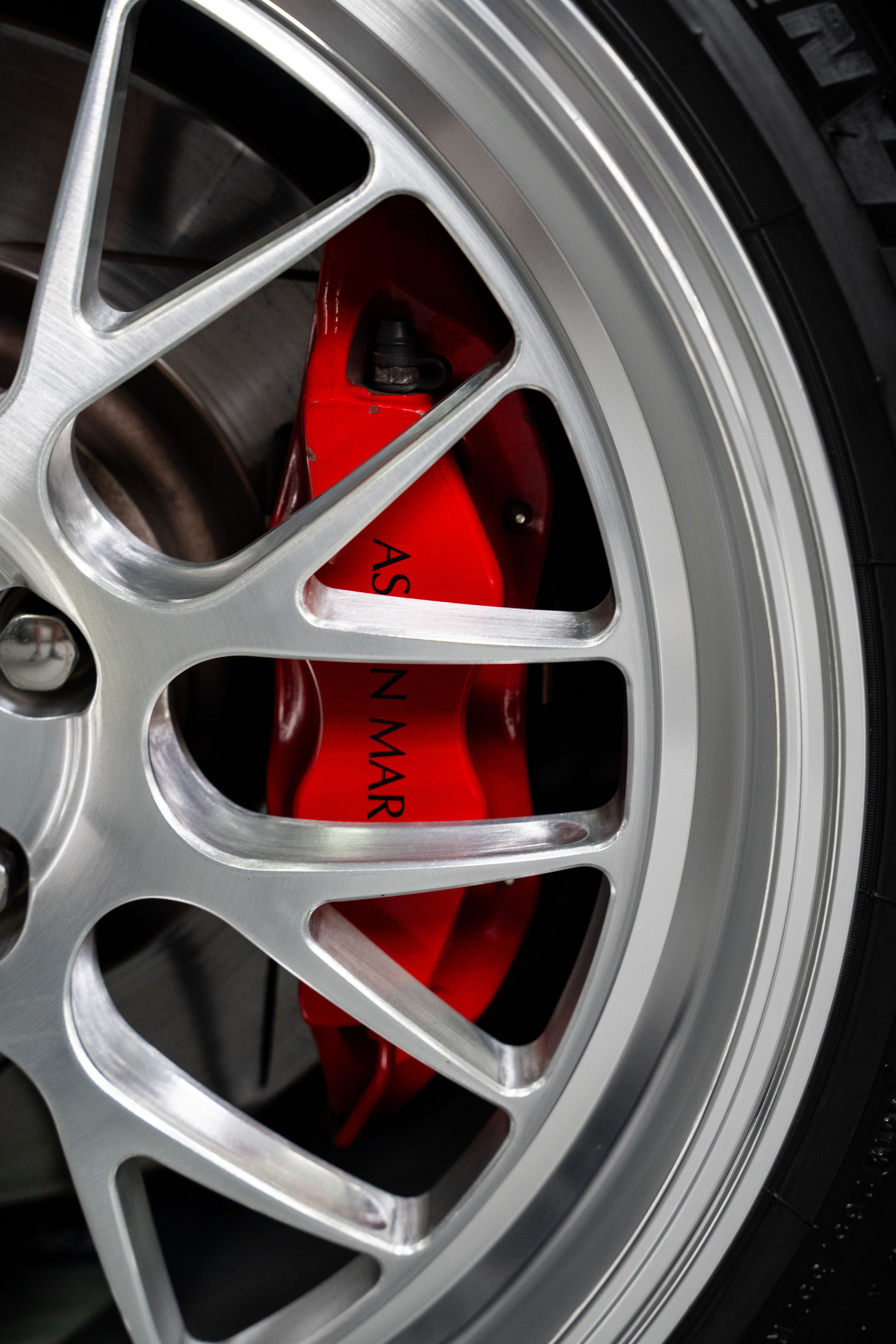 Black Aston Martin V8/V12 Vantage with 19" ML-10RT Apex wheels in Machined Lip Brushed Clear