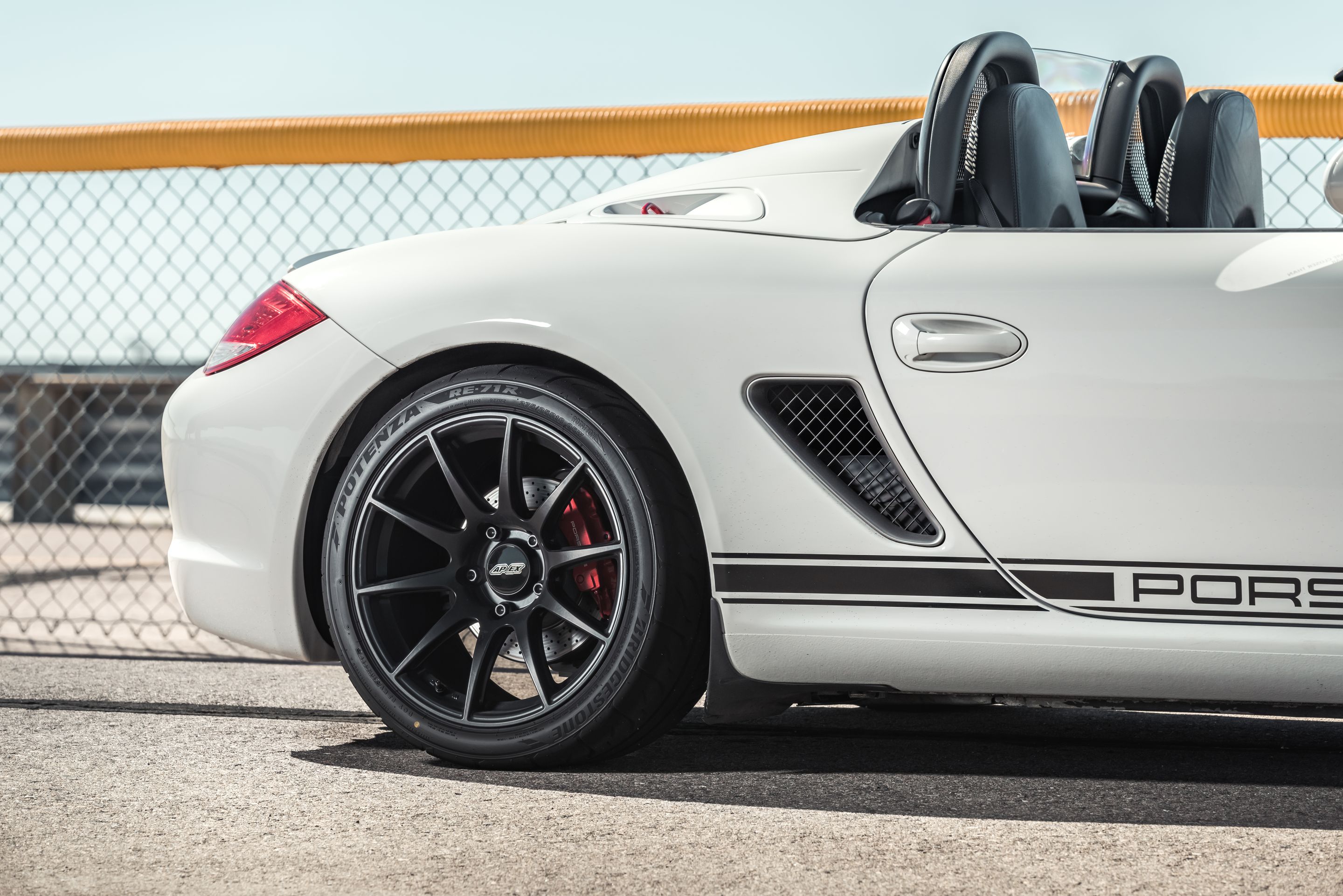 White Porsche 987 Boxster Spyder with 18" SM-10 Apex wheels in Satin Black