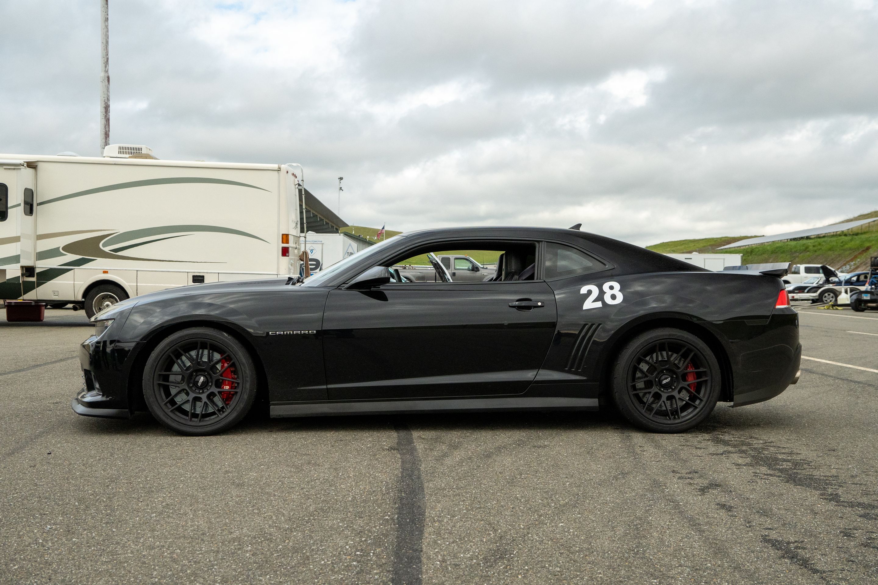 Black Chevrolet 5th Gen Camaro SS with 19" ARC-8 Apex wheels in Satin Black