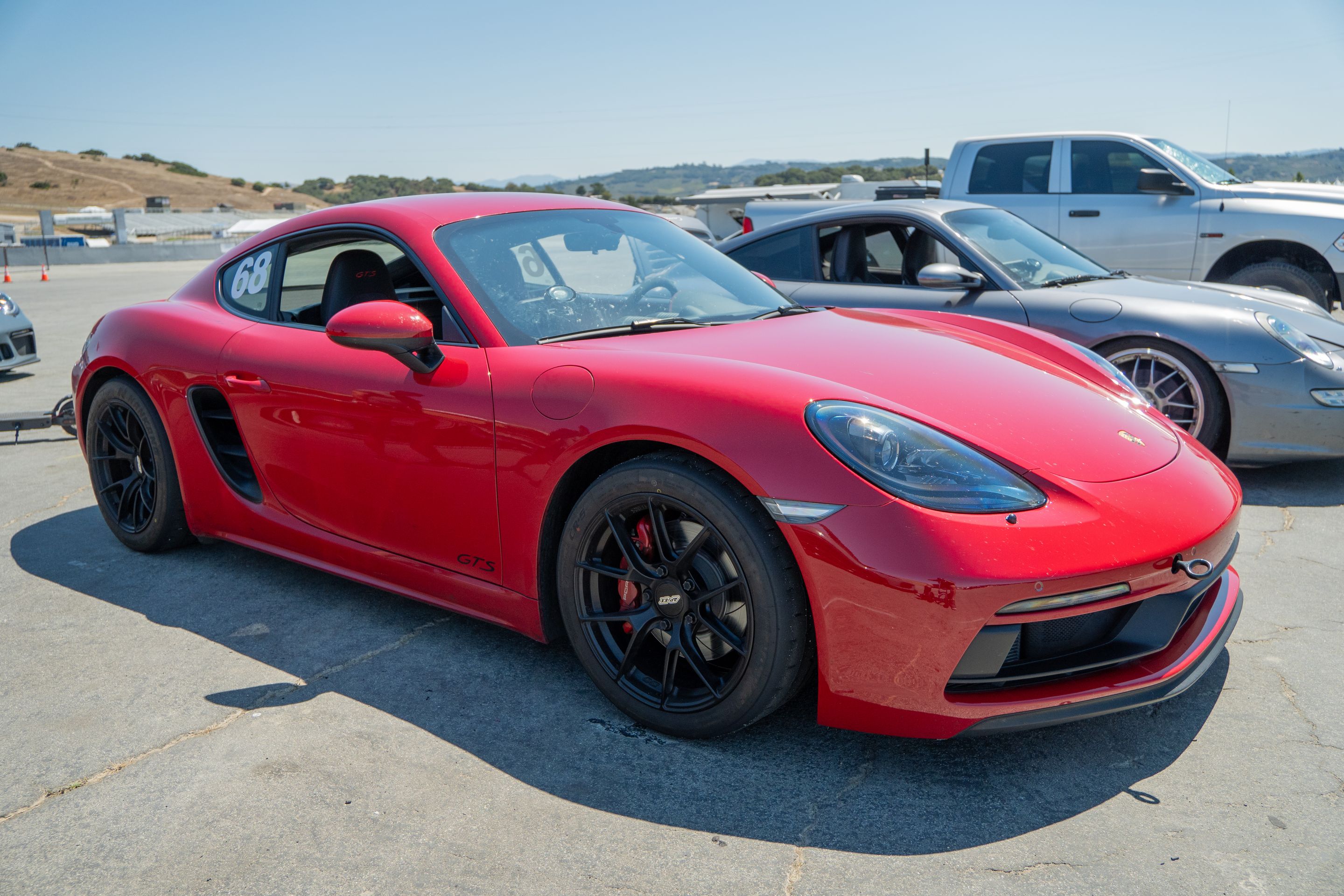 Red Porsche 718 Cayman GTS 2.5L with 18" VS-5RS Apex wheels in Satin Black
