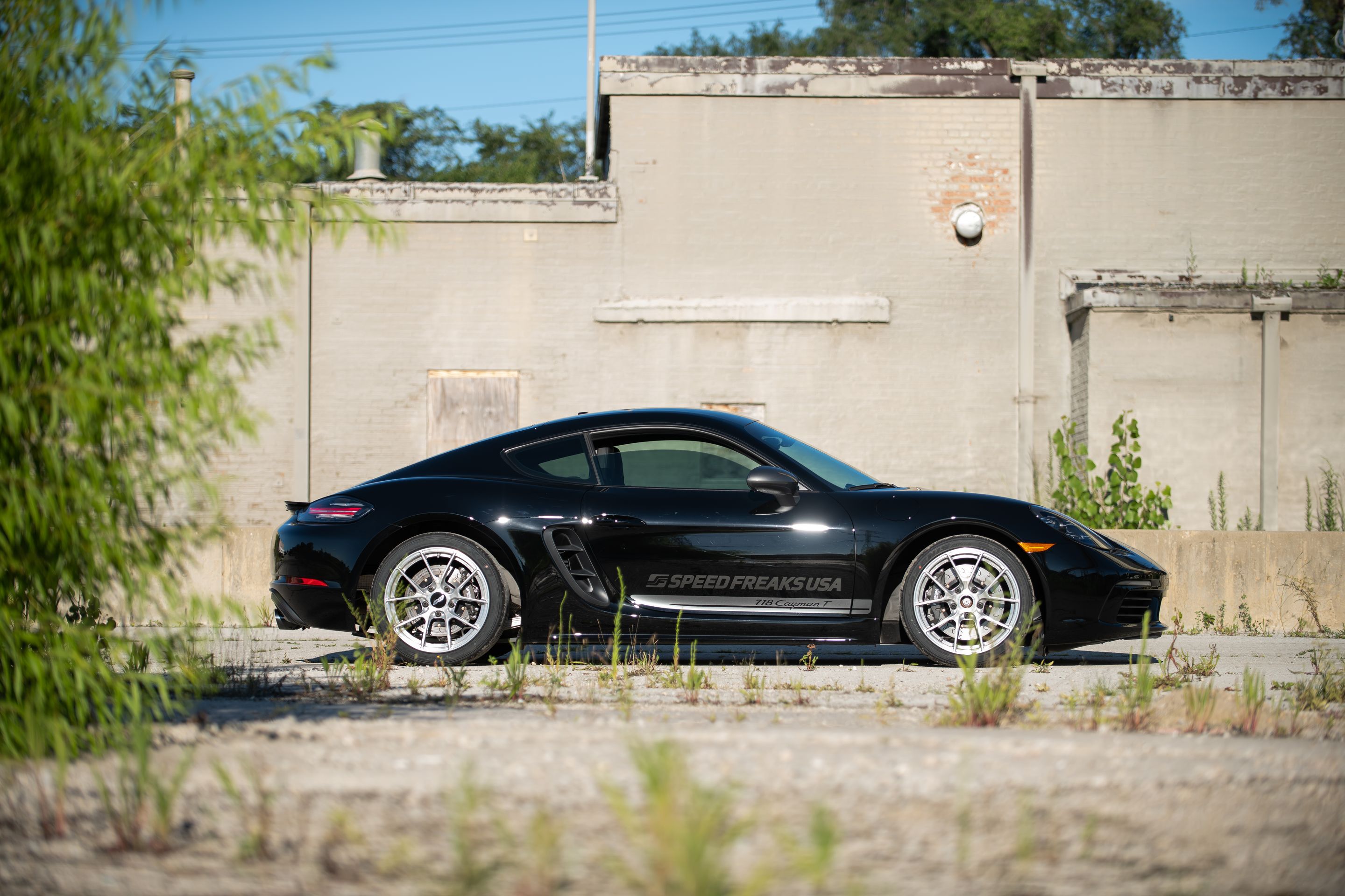 Black Porsche 718 Cayman T with 18" VS-5RS Apex wheels in Brushed Clear