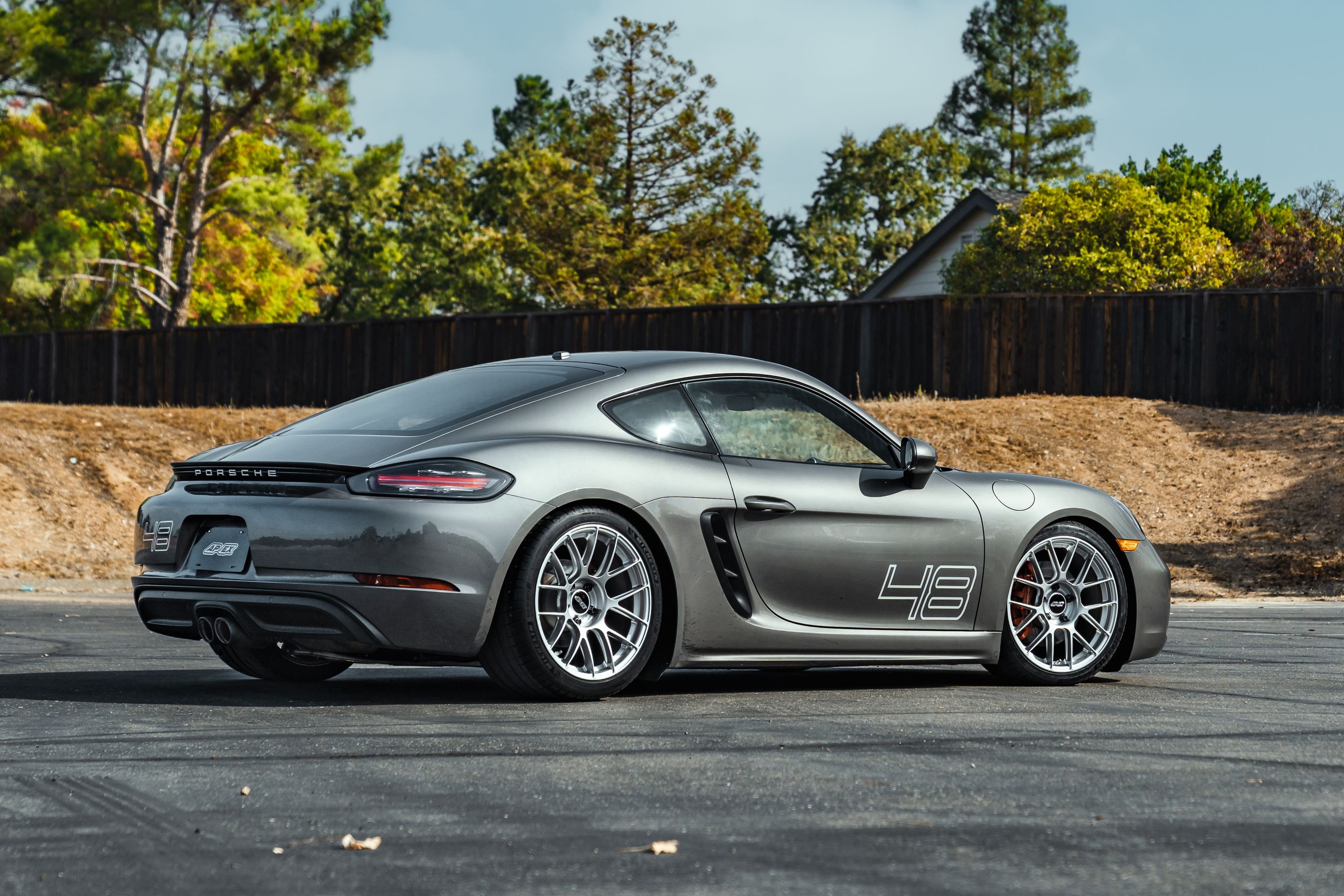 Grey Porsche 718 Cayman S with 19" EC-7RS Apex wheels in Race Silver