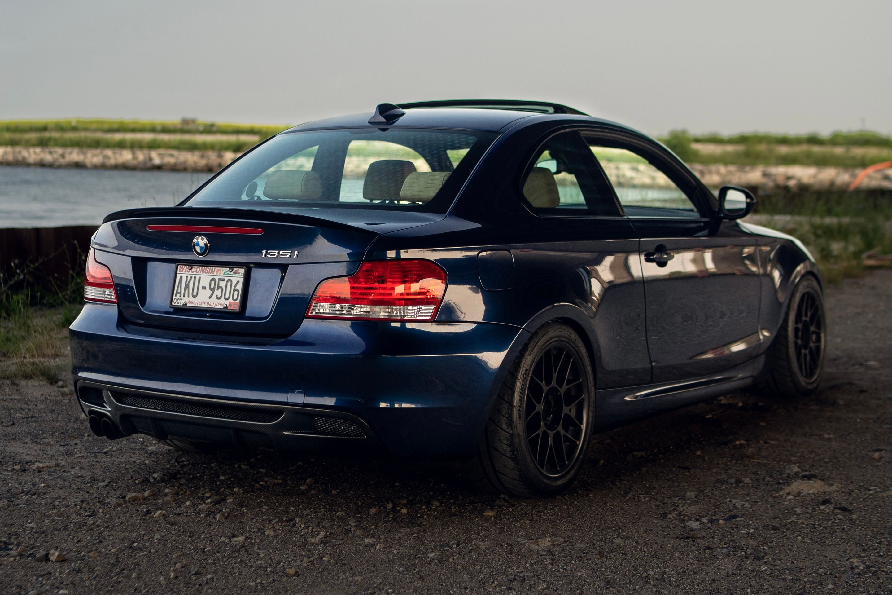 Blue BMW E82 Coupe 1 Series with 17" ARC-8 Apex wheels in Satin Black