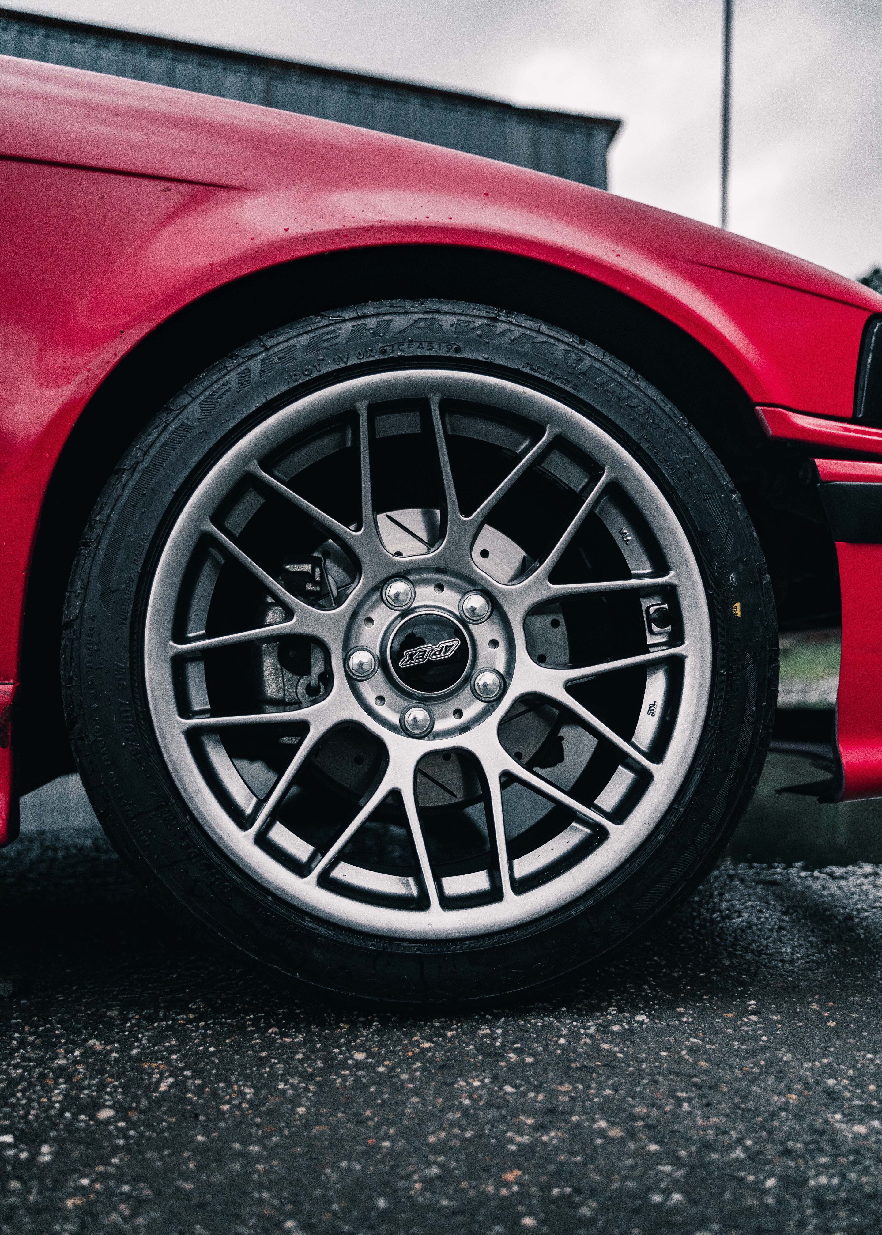 Red BMW E36 3 Series with 17" ARC-8 Apex wheels in Hyper Black